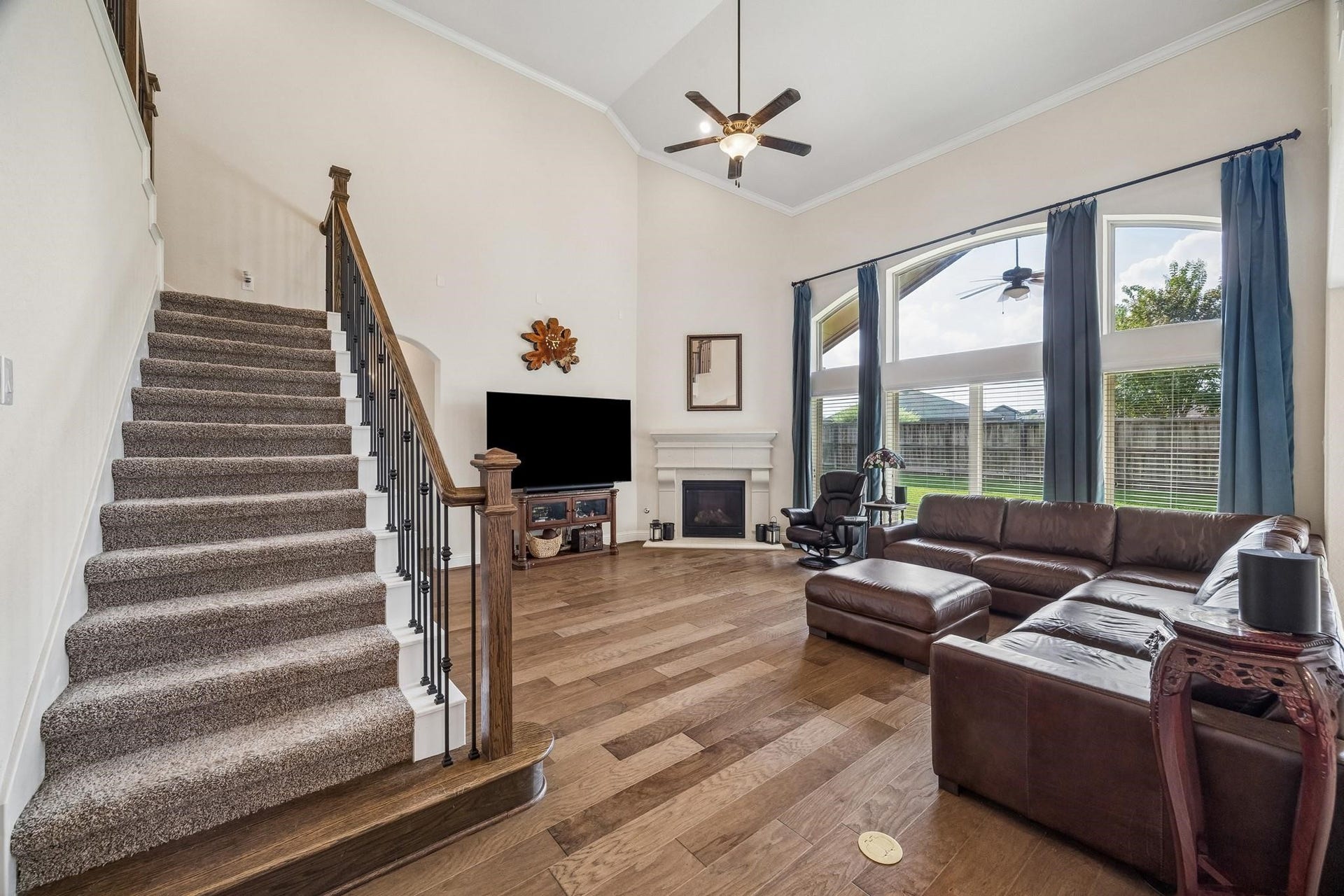 6031 Granite Shadow Lane, Porter, TX 77365 Rich wood handrails, wrought-iron balusters, and plush carpeting.