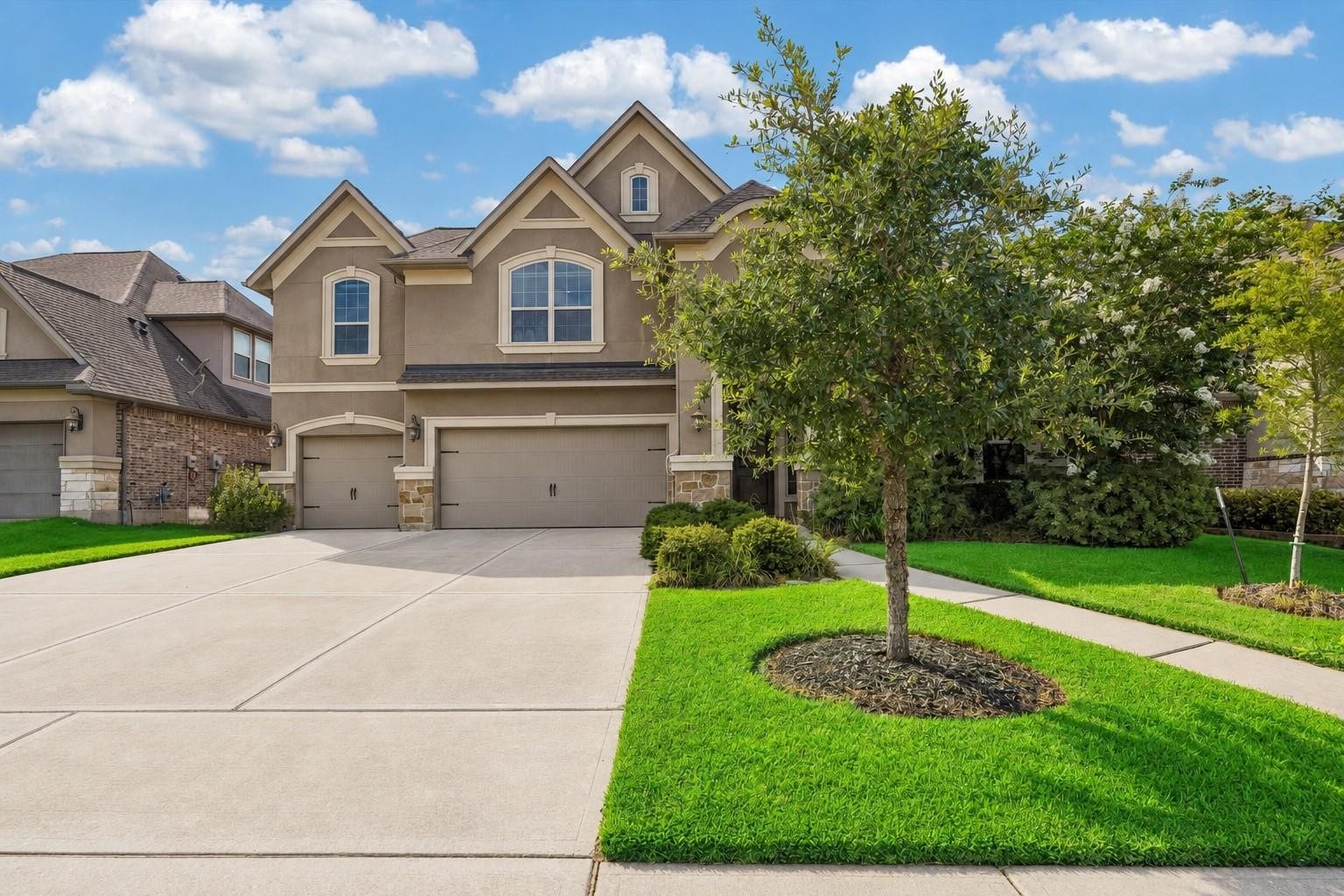 6031 Granite Shadow Lane, Porter, TX 77365 Stucco and stonework facade