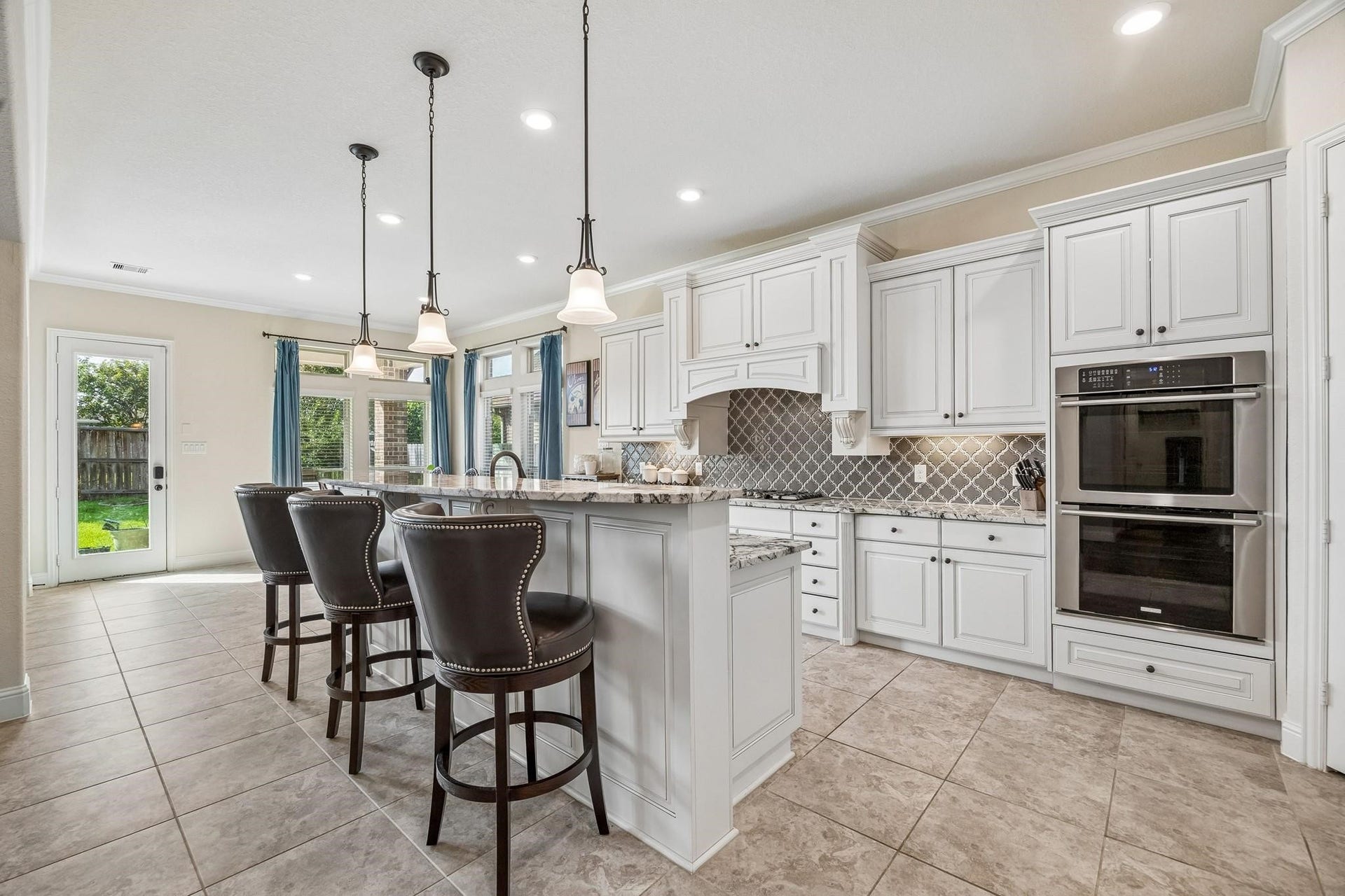 6031 Granite Shadow Lane, Porter, TX 77365 Exceptional kitchen with bar seating and double ovens.