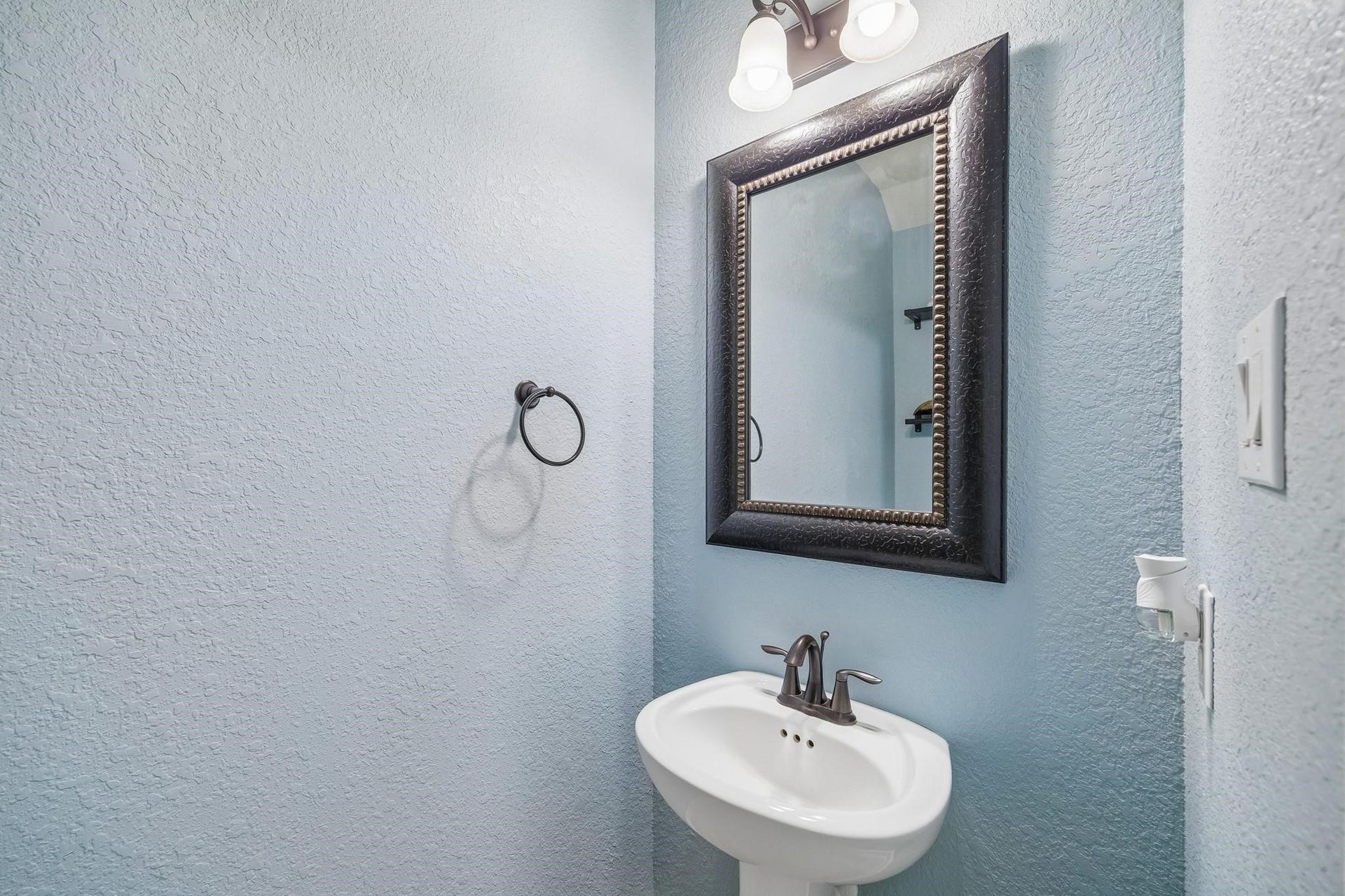 6031 Granite Shadow Lane, Porter, TX 77365 Conveniently located half bath for guests.