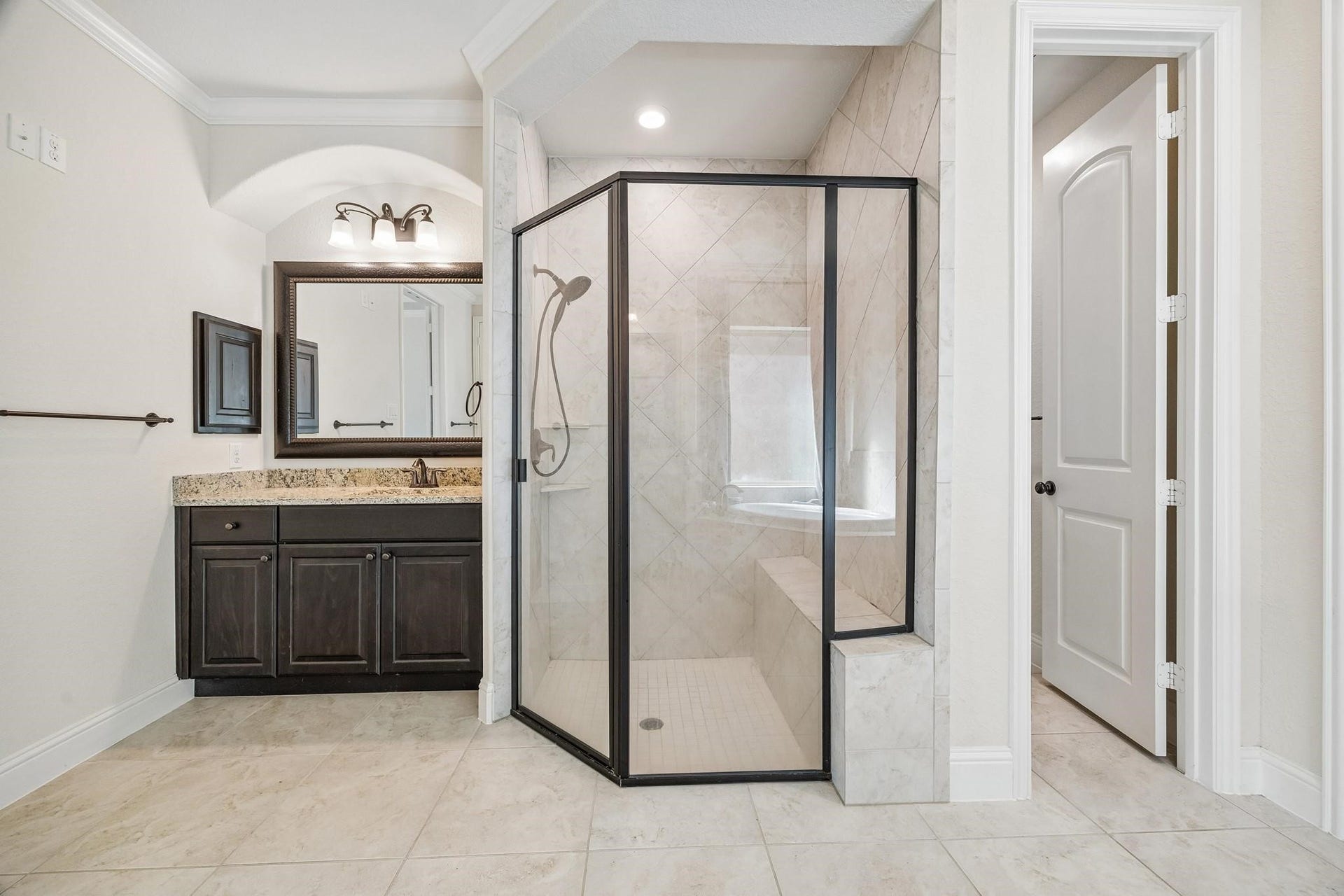 6031 Granite Shadow Lane, Porter, TX 77365 Large stand-in shower with glass door.