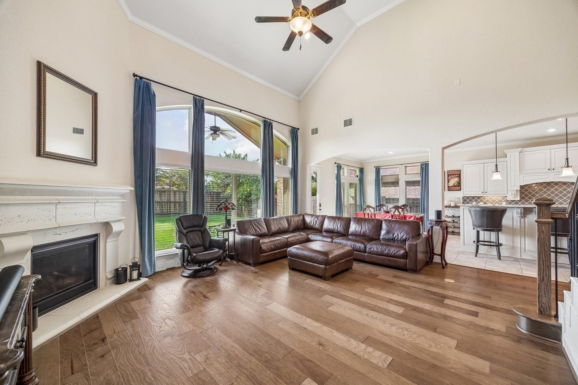 6031 Granite Shadow Lane, Porter, TX 77365 Stunning wood flooring and cast stone fireplace.