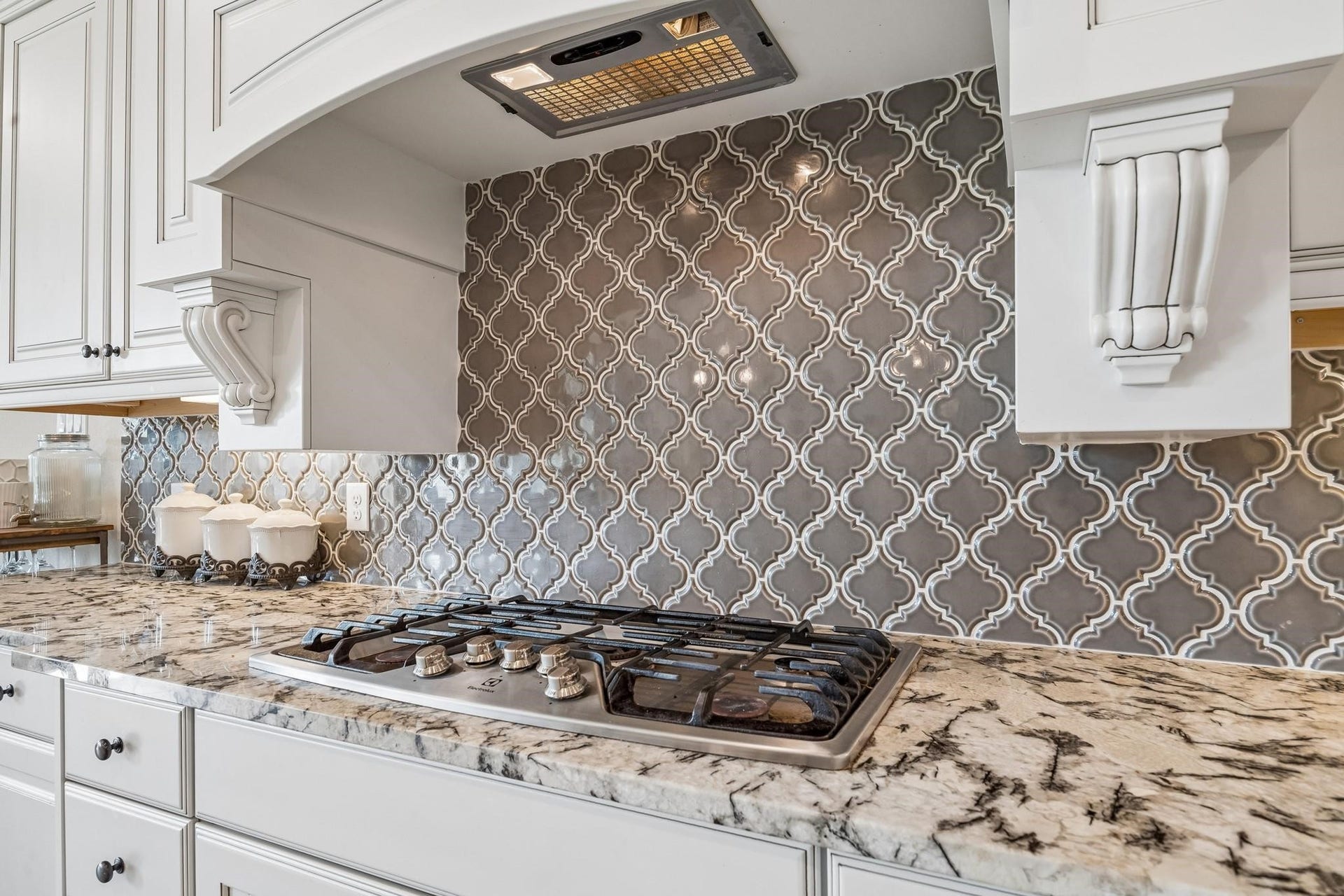 6031 Granite Shadow Lane, Porter, TX 77365 Stunning backsplash in kitchen.