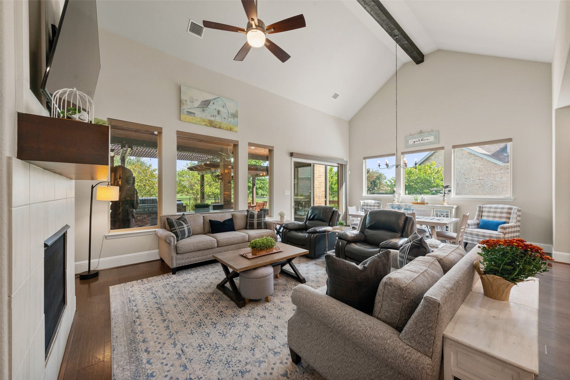 23926 Arcola Glen Lane, Katy, TX 77493 The family room and adjoining dining room feature an open, airy layout enhanced by an abundance of natural light through expansive windows.