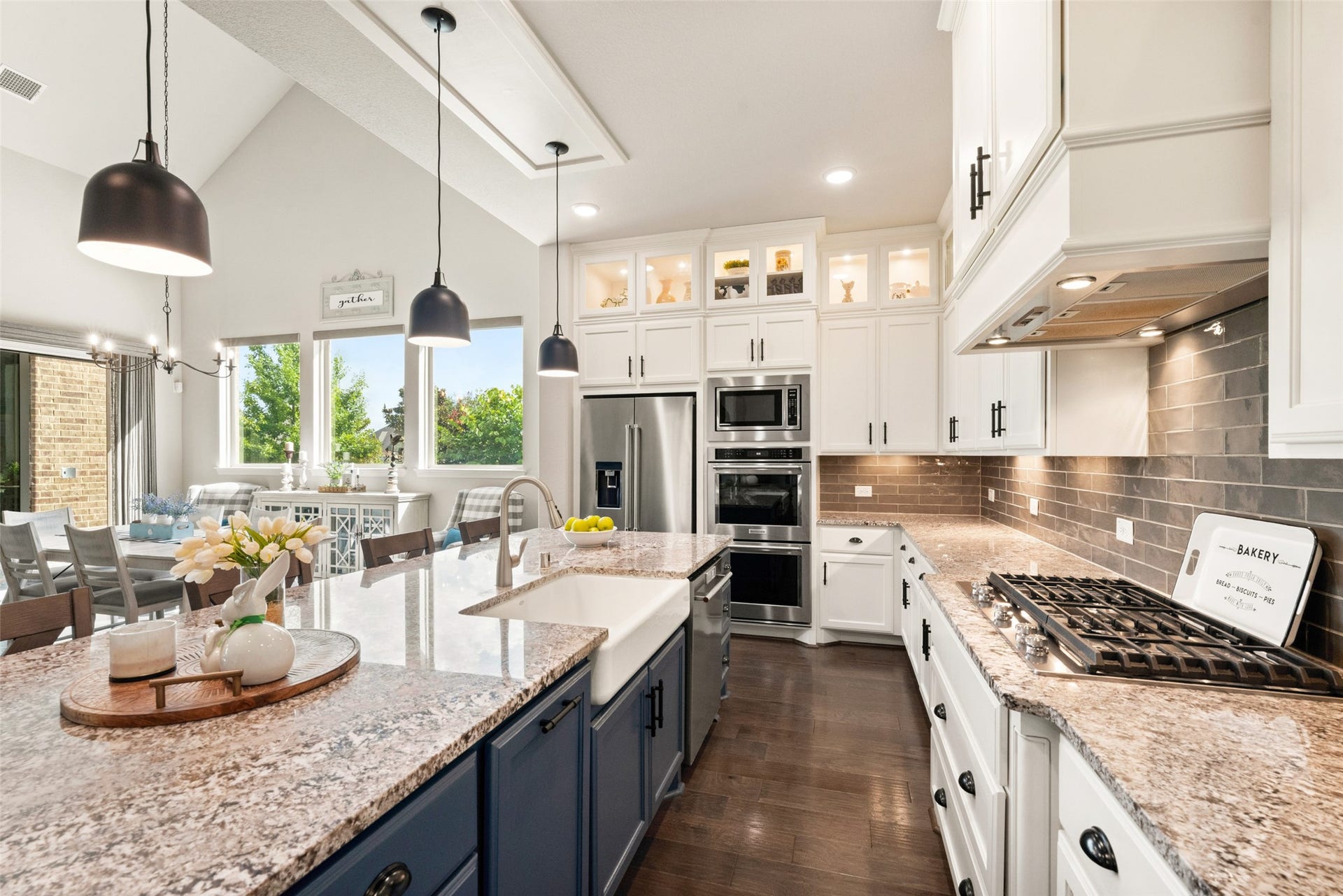 23926 Arcola Glen Lane, Katy, TX 77493 Sleek stainless steel appliances, including built-in double ovens with a microwave, a gas cooktop, and a dishwasher, add high-end functionality to this modern kitchen.