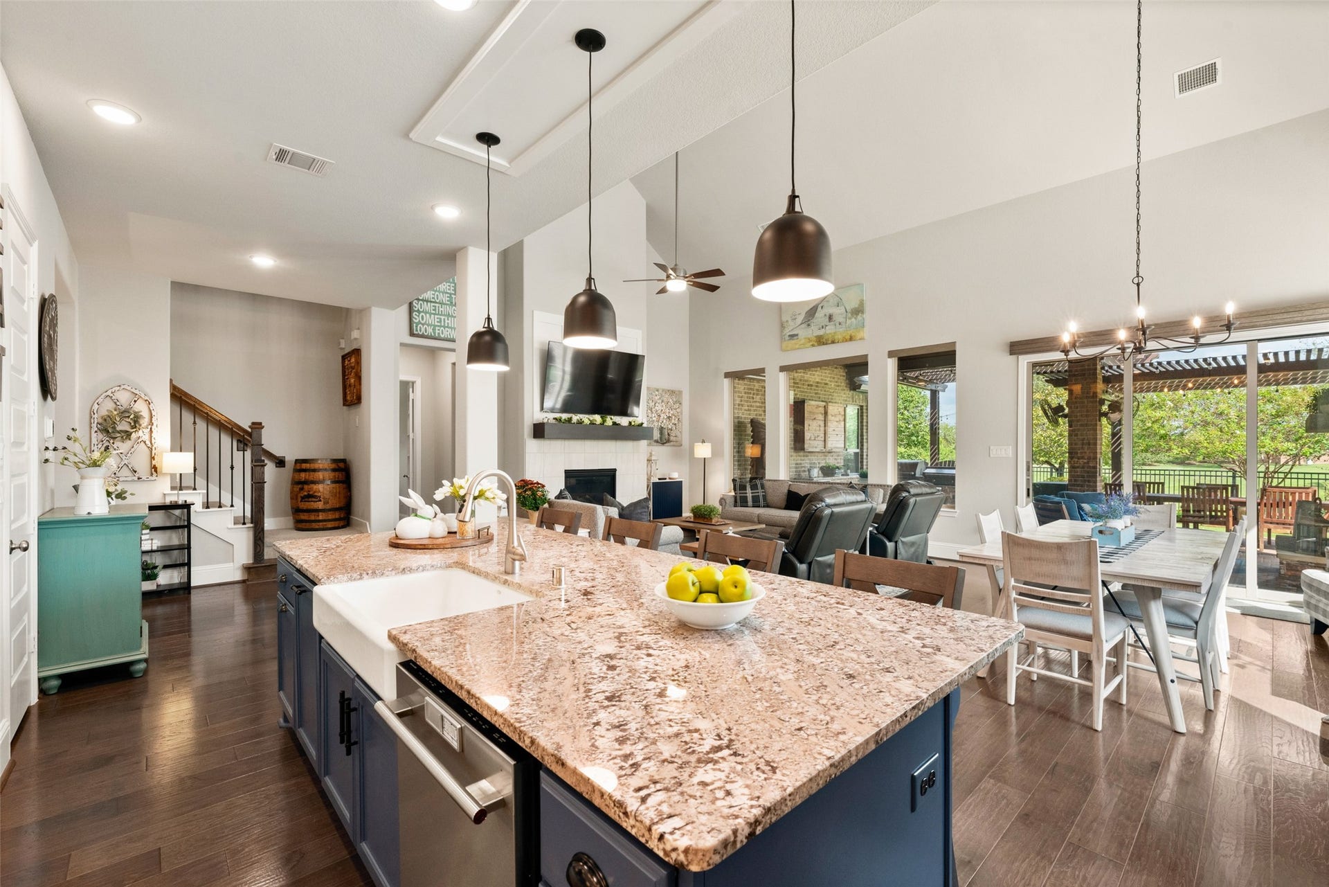 23926 Arcola Glen Lane, Katy, TX 77493 The kitchen features an open-concept layout with views overlooking the family and dining rooms. Highlights include warm, textured granite countertops and a premium farmhouse porcelain sink that adds an upscale touch.