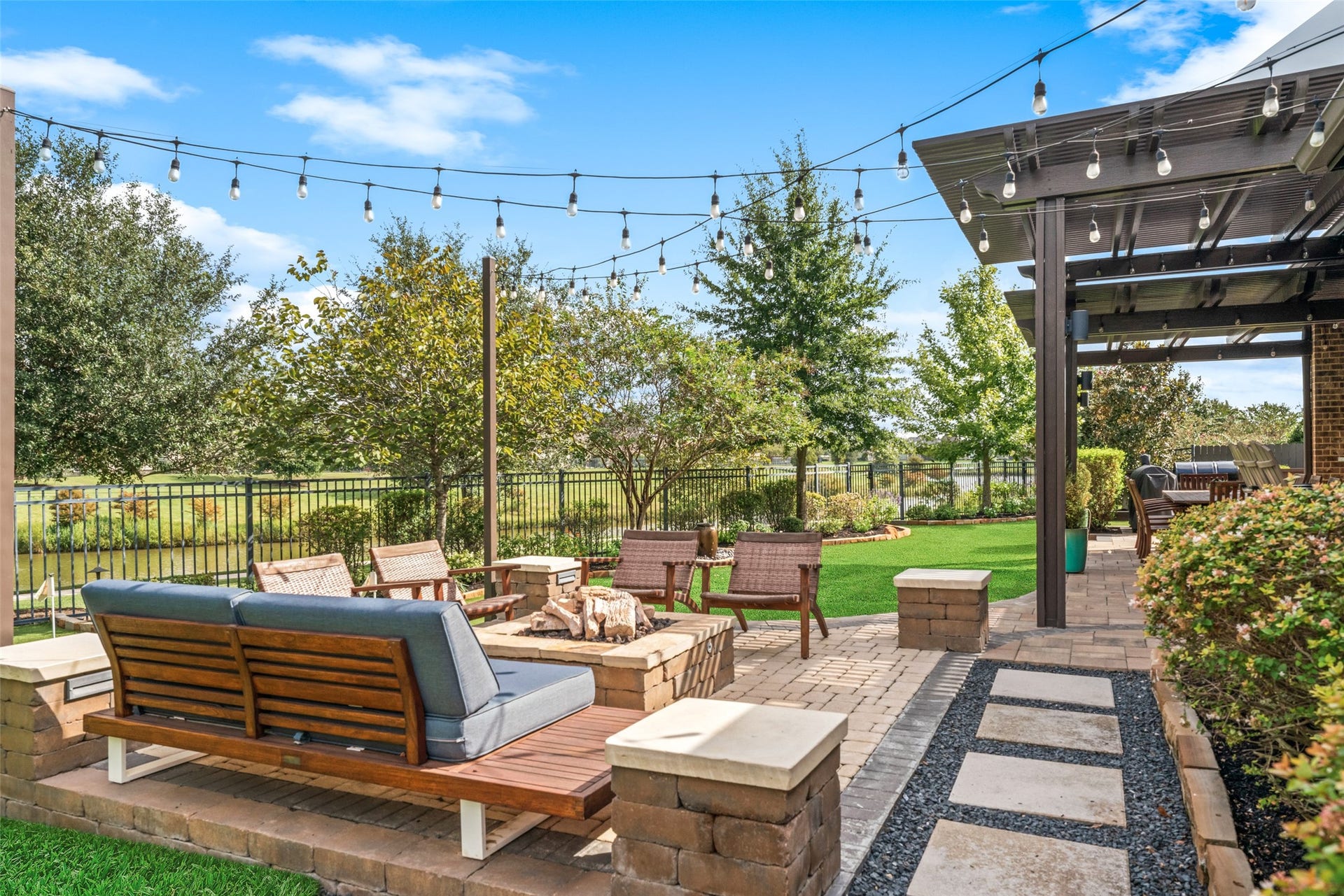 23926 Arcola Glen Lane, Katy, TX 77493 Professional, high-end landscape and architectural design enhance the backyard, creating an inviting and upscale atmosphere.
