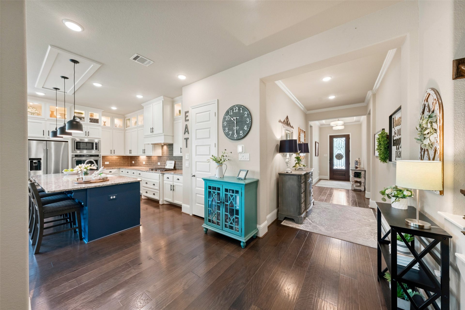 23926 Arcola Glen Lane, Katy, TX 77493 Inviting designer colors and finishes give this home an upscale feel. The neutral wall color paired with dark wood flooring creates a gorgeous aesthetic that complements any decor style.