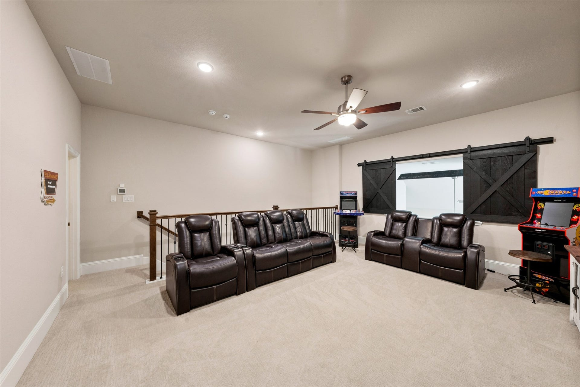 23926 Arcola Glen Lane, Katy, TX 77493 Upstairs game/media room has custom sliding barn doors for privacy.