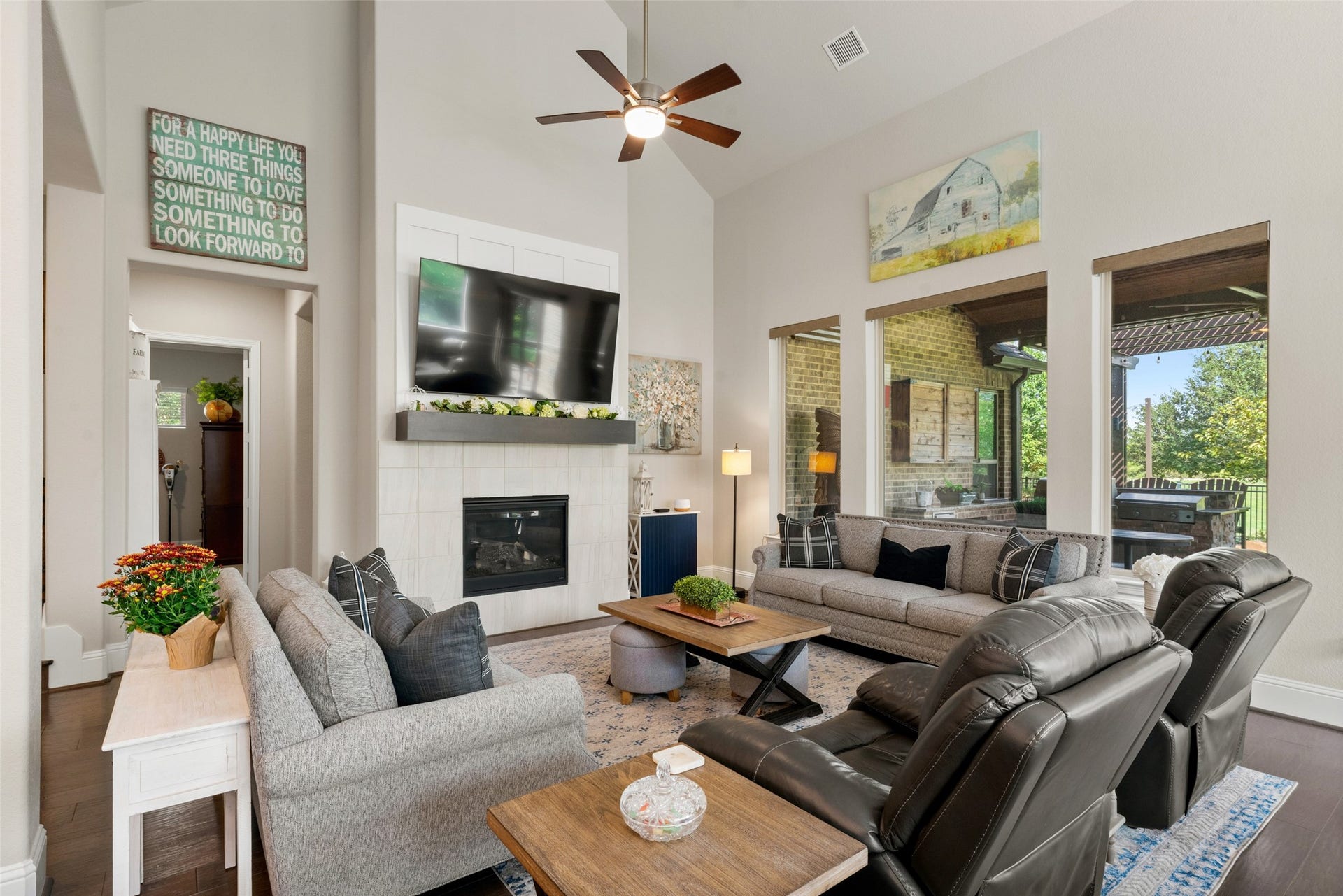 23926 Arcola Glen Lane, Katy, TX 77493 Plate glass windows provide gorgeous views to the backyard and covered lanai, while the automated shades add a sophisticated, upscale touch to the living space.