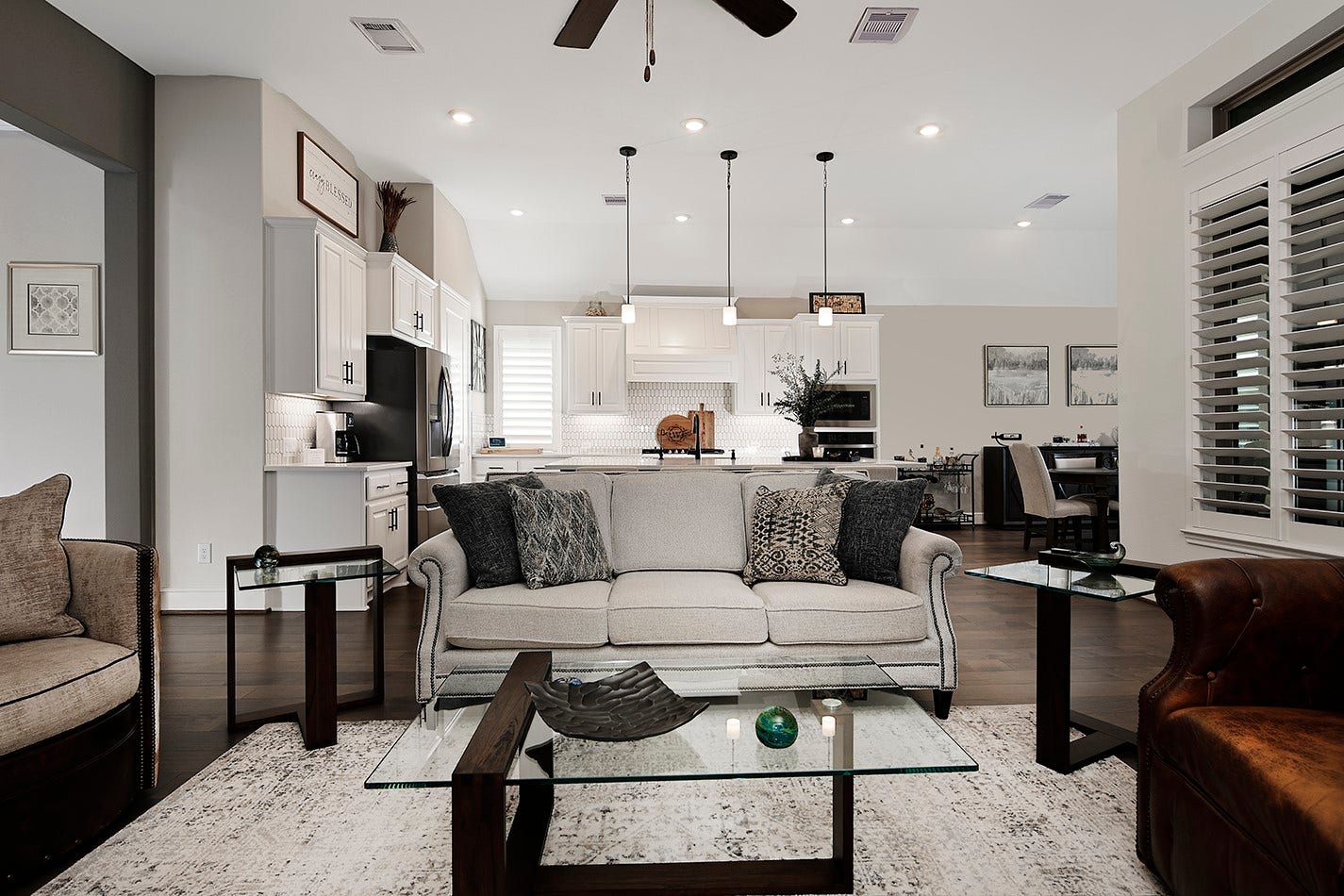 10135 Lehman Drive, Willis, TX 77318 The open-concept floor plan connects the family room, kitchen, and dining area, creating a seamless flow. Each room features a sophisticated color palette that creates a warm and welcoming atmosphere throughout the home.