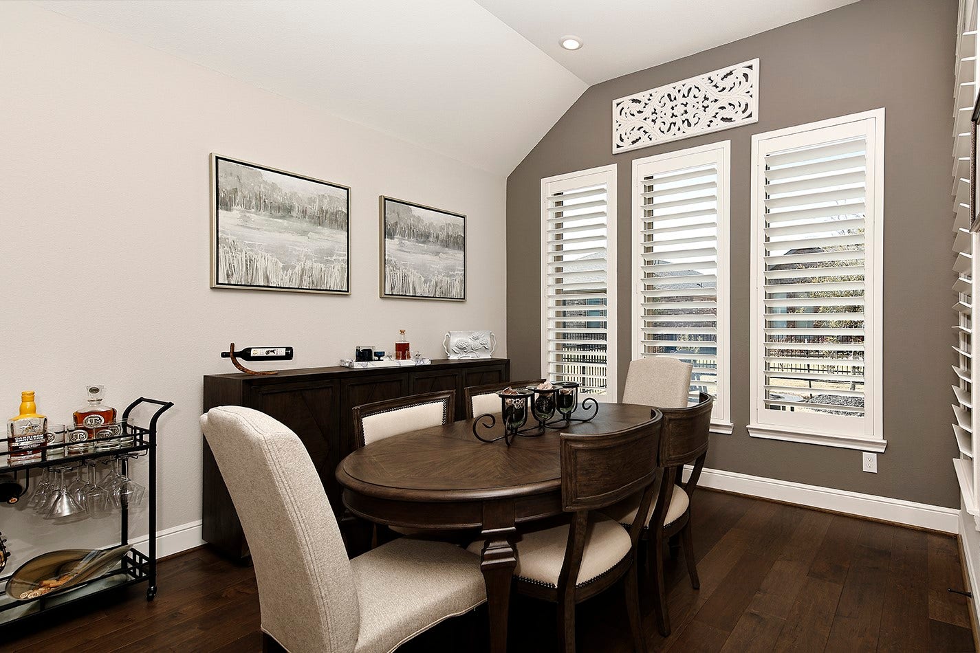 10135 Lehman Drive, Willis, TX 77318 This spacious dining room features plantation shutters overlooking the backyard providing an ideal setting for hosting family and friends around a large table.