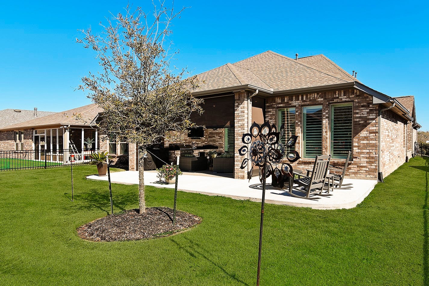 10135 Lehman Drive, Willis, TX 77318 Spacious backyard featuring wrought iron fencing to provide an open, airy feel and unobstructed views.