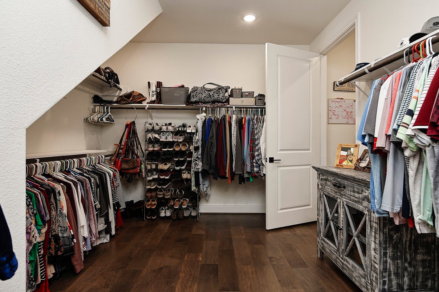 10135 Lehman Drive, Willis, TX 77318 Spacious primary closet has custom built-ins with a place for everything.