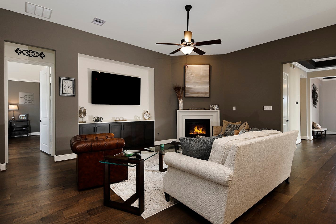 10135 Lehman Drive, Willis, TX 77318 S Spacious family room featuring an inviting ambiance, a cozy gaslog fireplace, and ample space for a comfortable seating arrangement perfect for relaxing or entertaining guests.