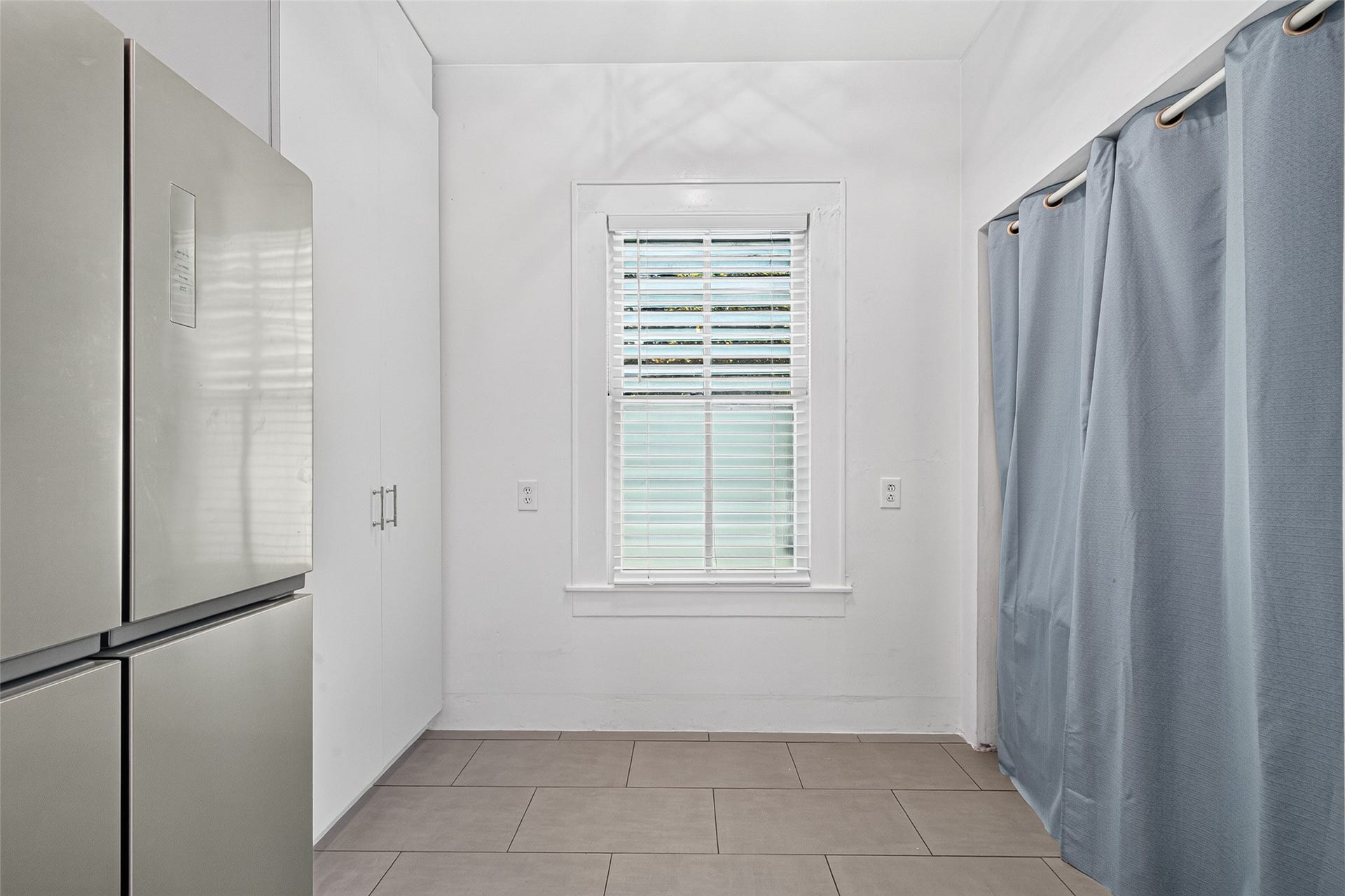 4807 Avenue P 1/2, Galveston, TX 77551 FRIDGE, PANTRY, AND "ALL IN ONE" WASHER DRYER COMBO ON THE RIGHT