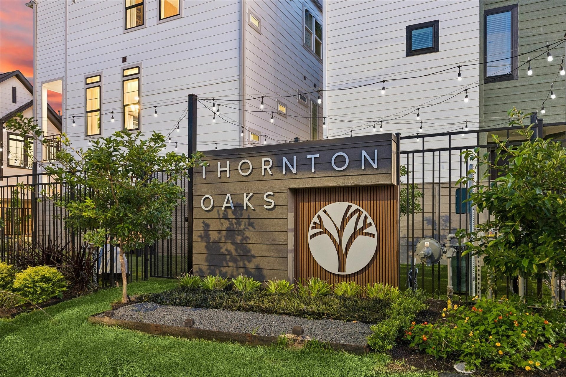 Discover Thornton Oaks, a charming community featuring modern architecture, lush landscaping, and inviting outdoor lighting, perfect for your new home.