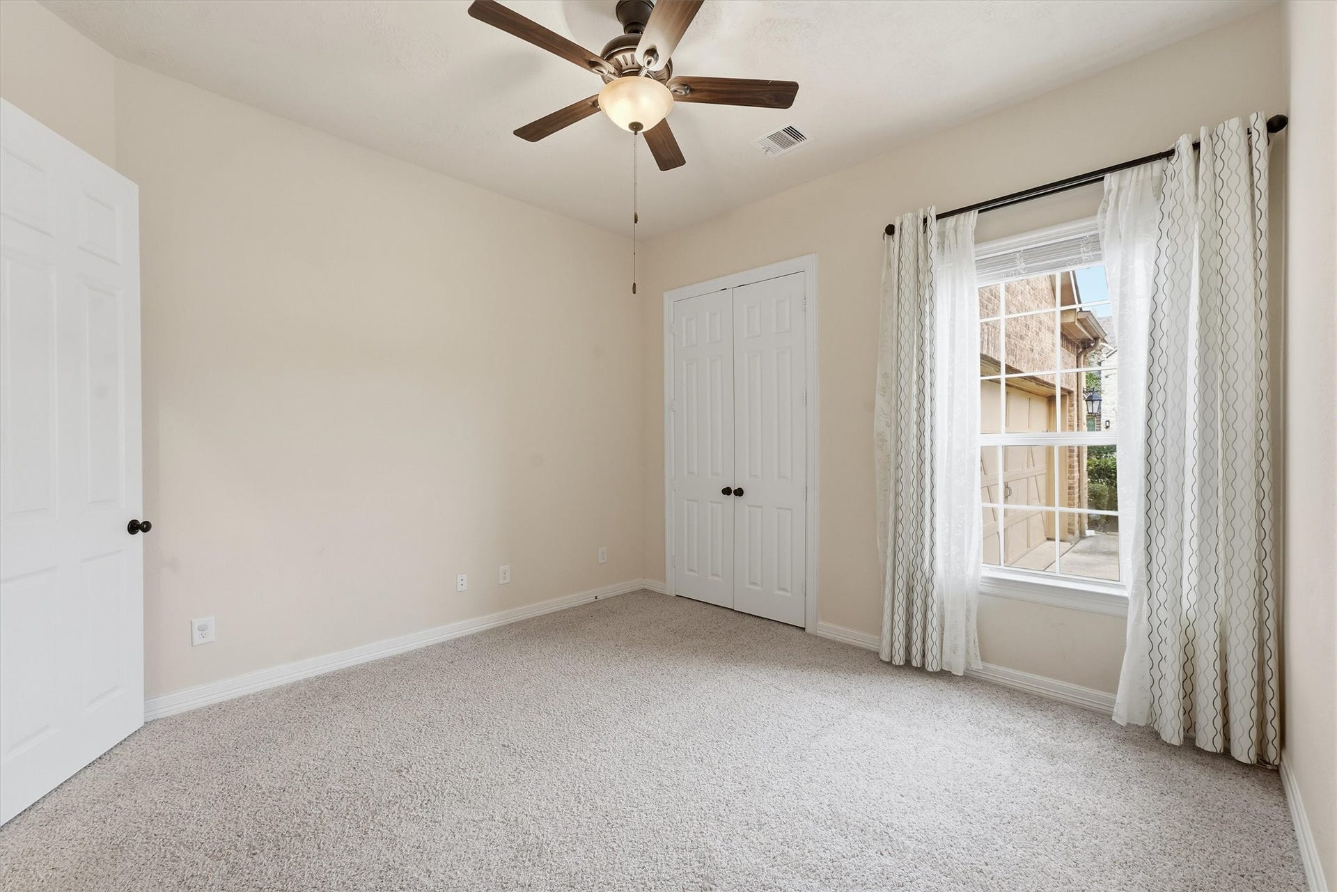 13920 N Lake Branch Lane, Houston, TX 77044 Bedroom #2 is downstairs, features a large closet and tons of natural light. Full bath is just across the hall.