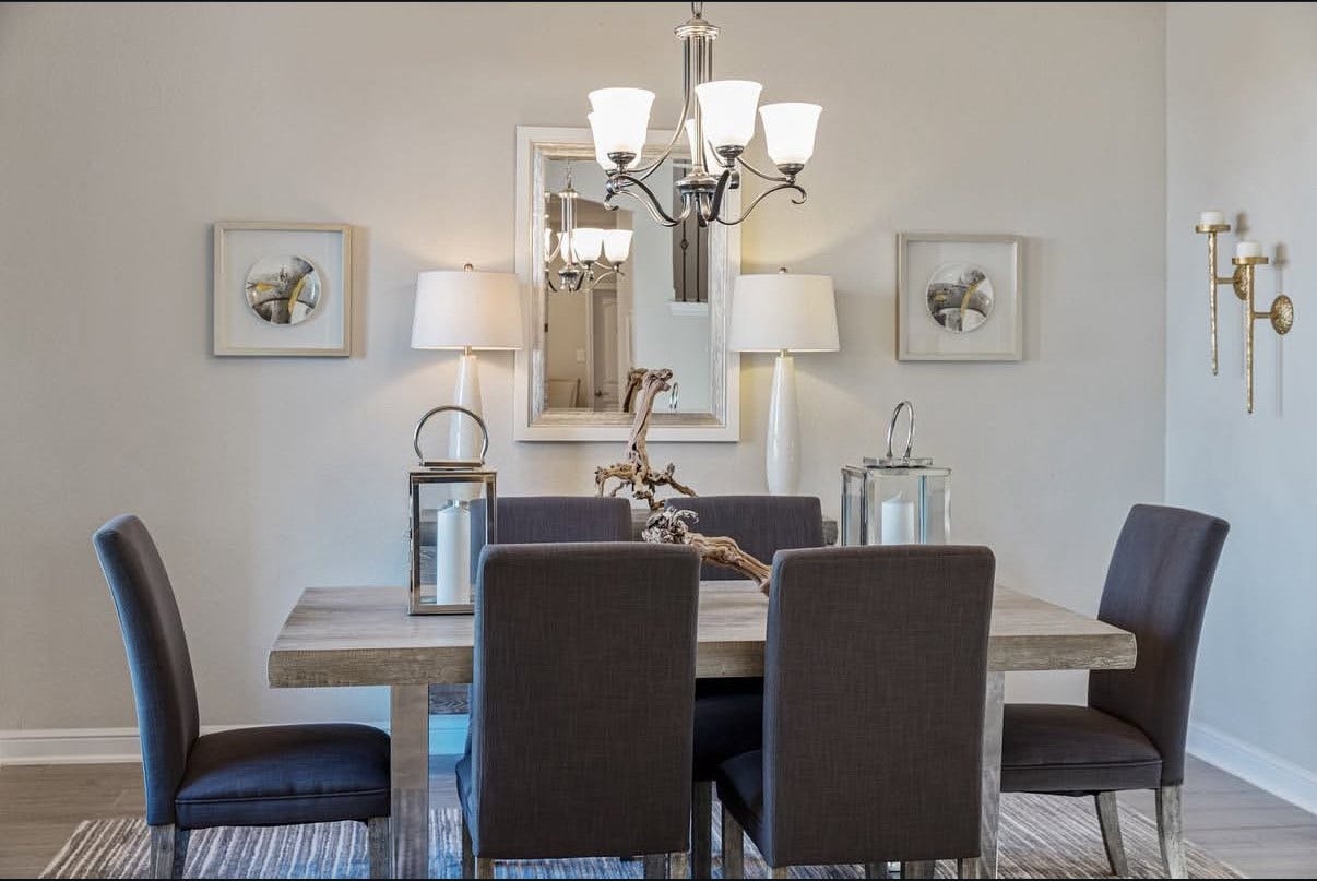 13201 Anchor Bay Drive, La Marque, TX 77568 Elegant dining area featuring ambient lighting with a modern lighting.