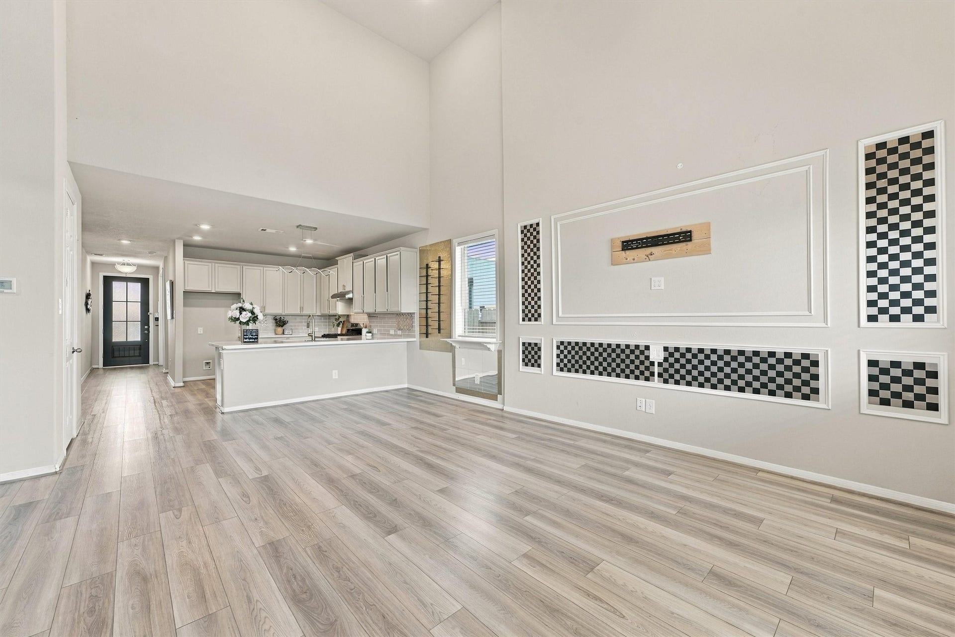Open-concept dining and kitchen flow seamlessly into the living room.