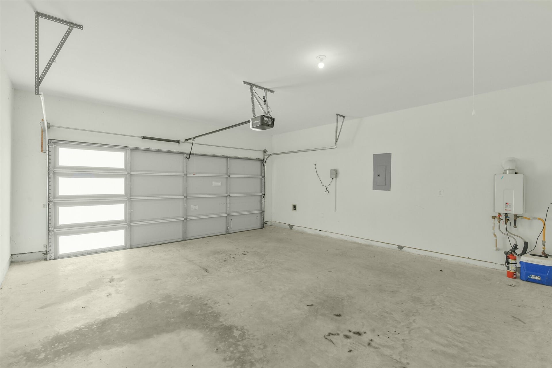 14322 Winema View Lane, Conroe, TX 77384 Light and bright garage with tankless water heather.