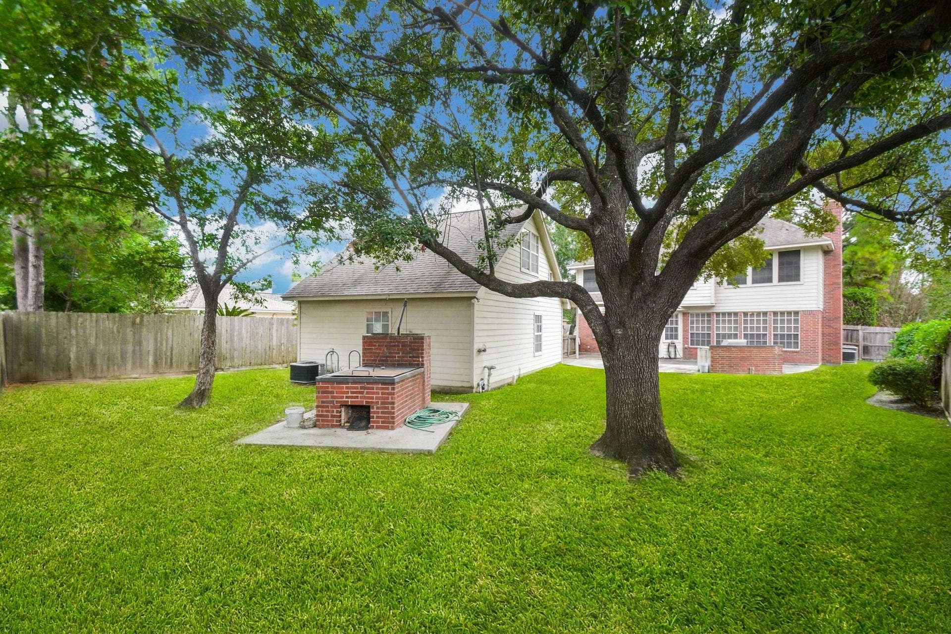 17122 Highland Canyon Drive, Houston, TX 77095 This yard is lovely and there is plenty of room for a pool and so much more.