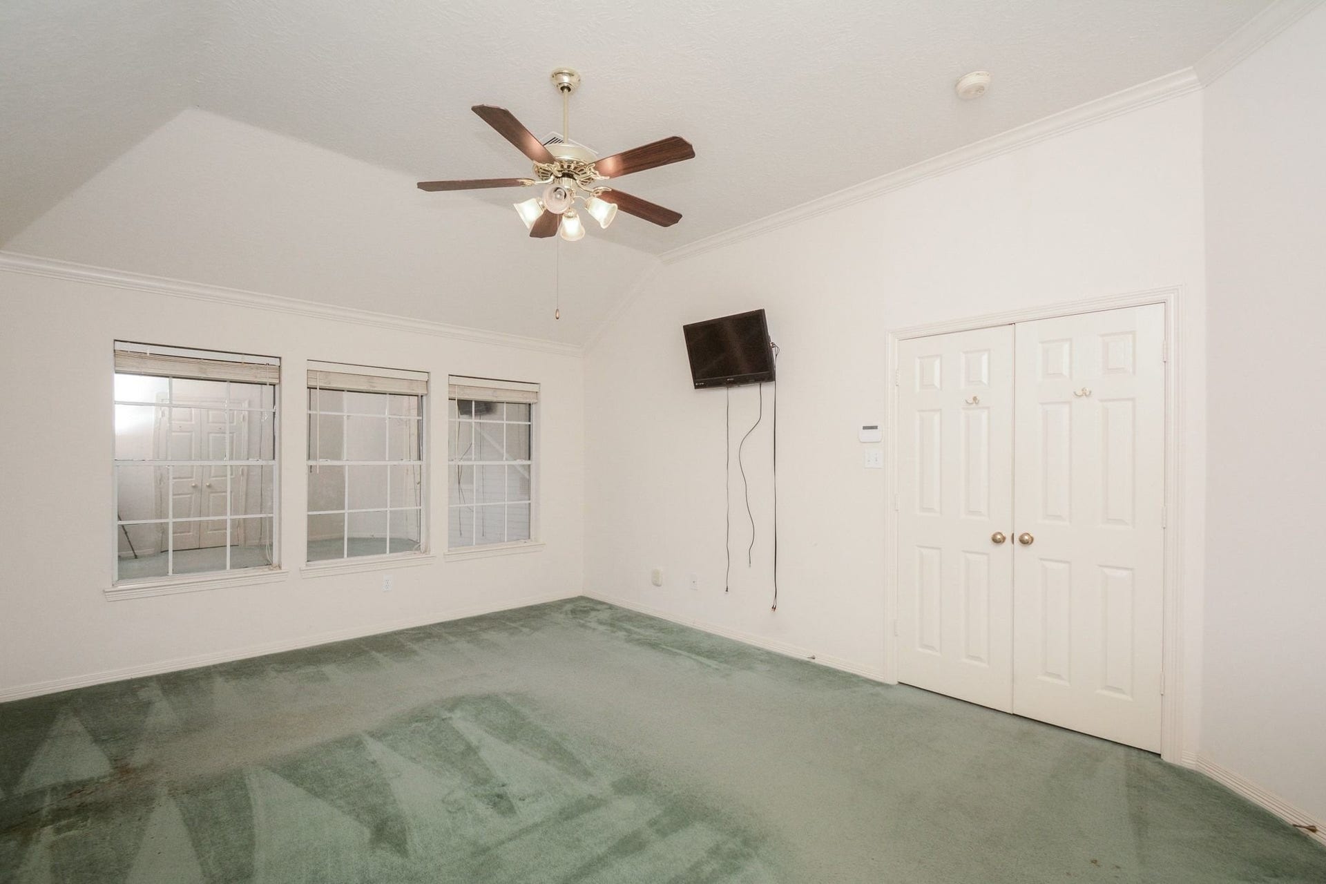 17122 Highland Canyon Drive, Houston, TX 77095 View of primary bedroom with wall of windows overlooking the backyard
