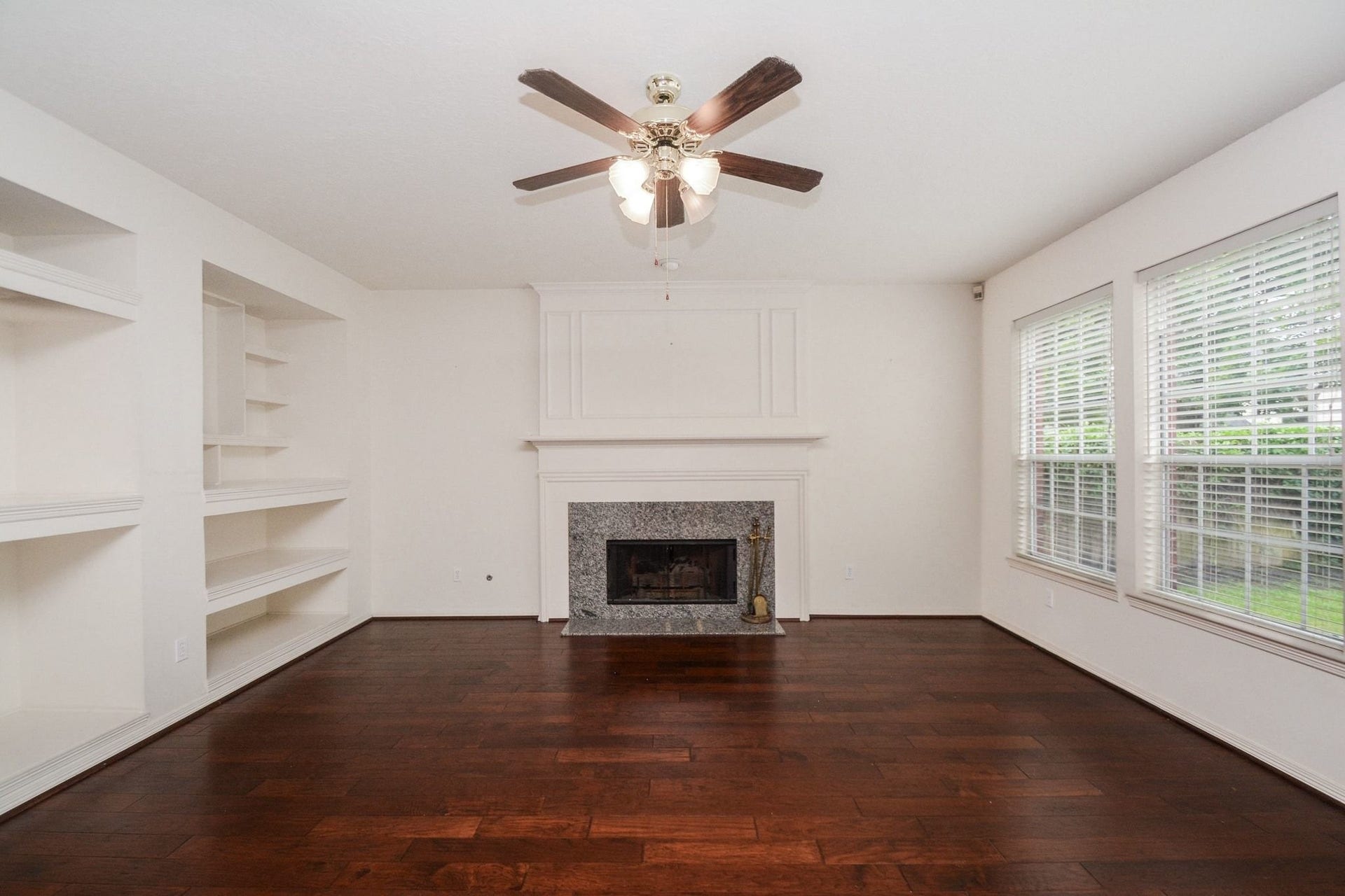 17122 Highland Canyon Drive, Houston, TX 77095 Den with hardwood floors and custom shelving