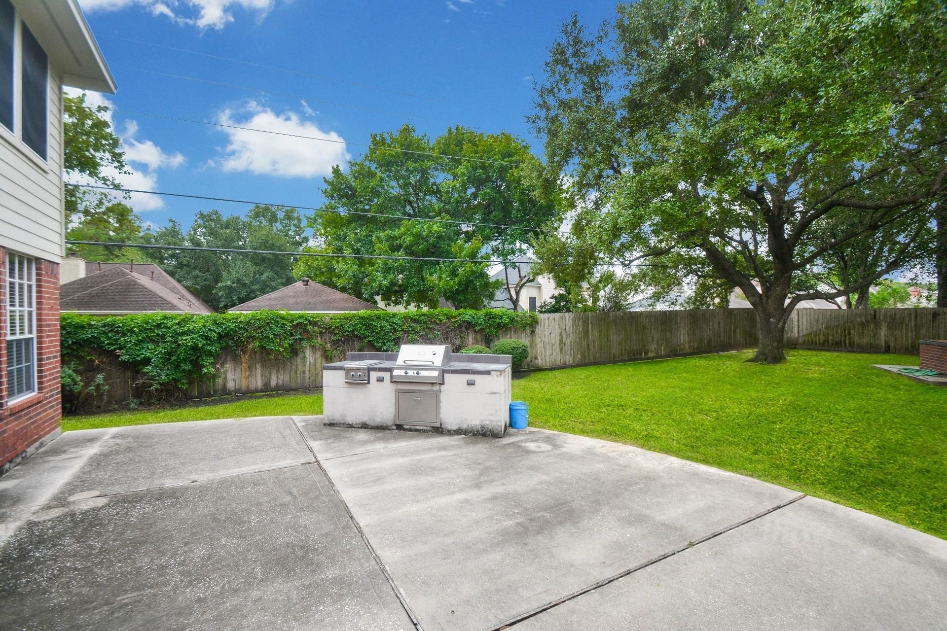 17122 Highland Canyon Drive, Houston, TX 77095 Extended patio decking and outdoor kitchen/grill area