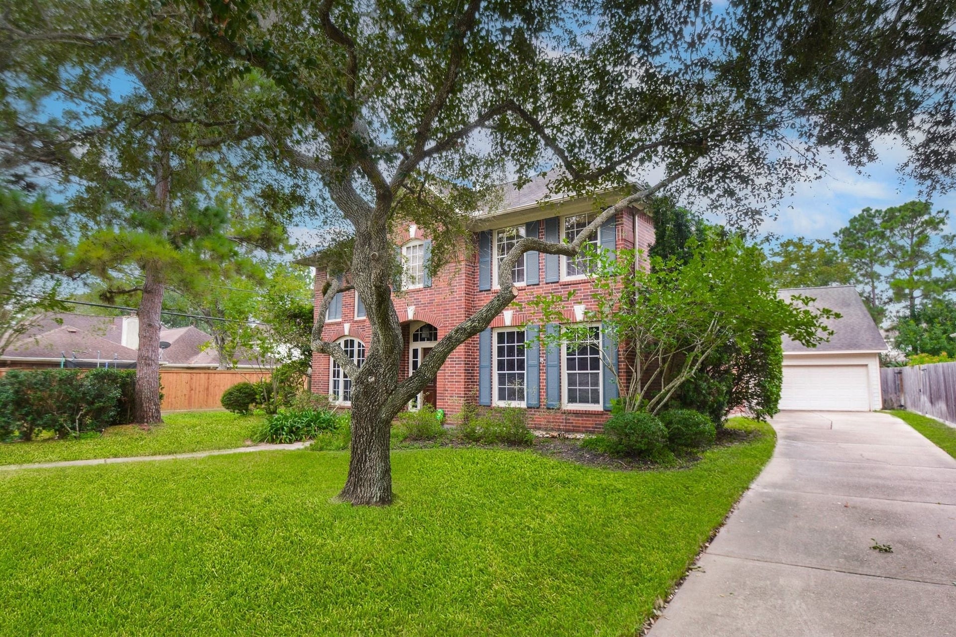 17122 Highland Canyon Drive, Houston, TX 77095 Home features a long driveway and a detached oversized garage with full hvac system