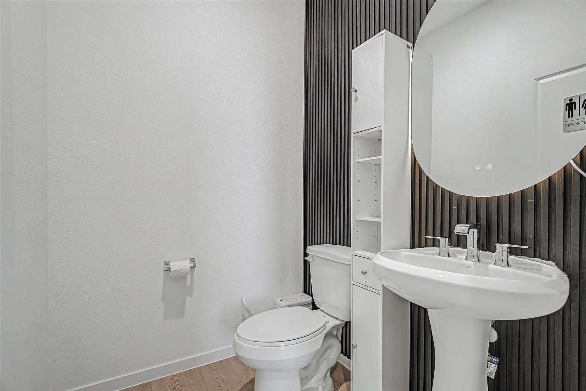 Convenient downstairs 1/2 bath with wall accent upgrade