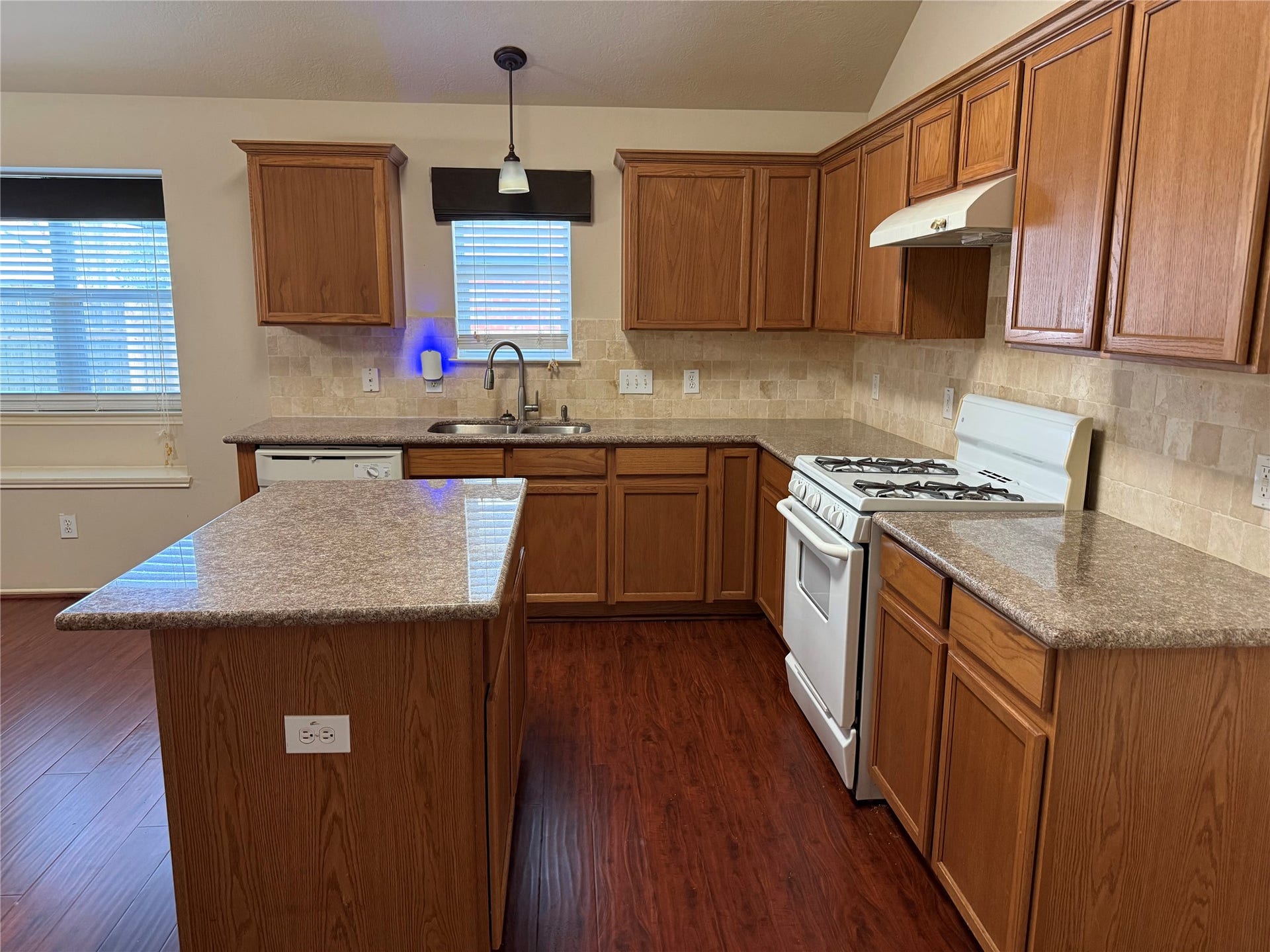 2104 Goldfinch Lane, League City, TX 77573 Step into this inviting home and discover a spacious island kitchen, perfect for culinary adventures and entertaining.