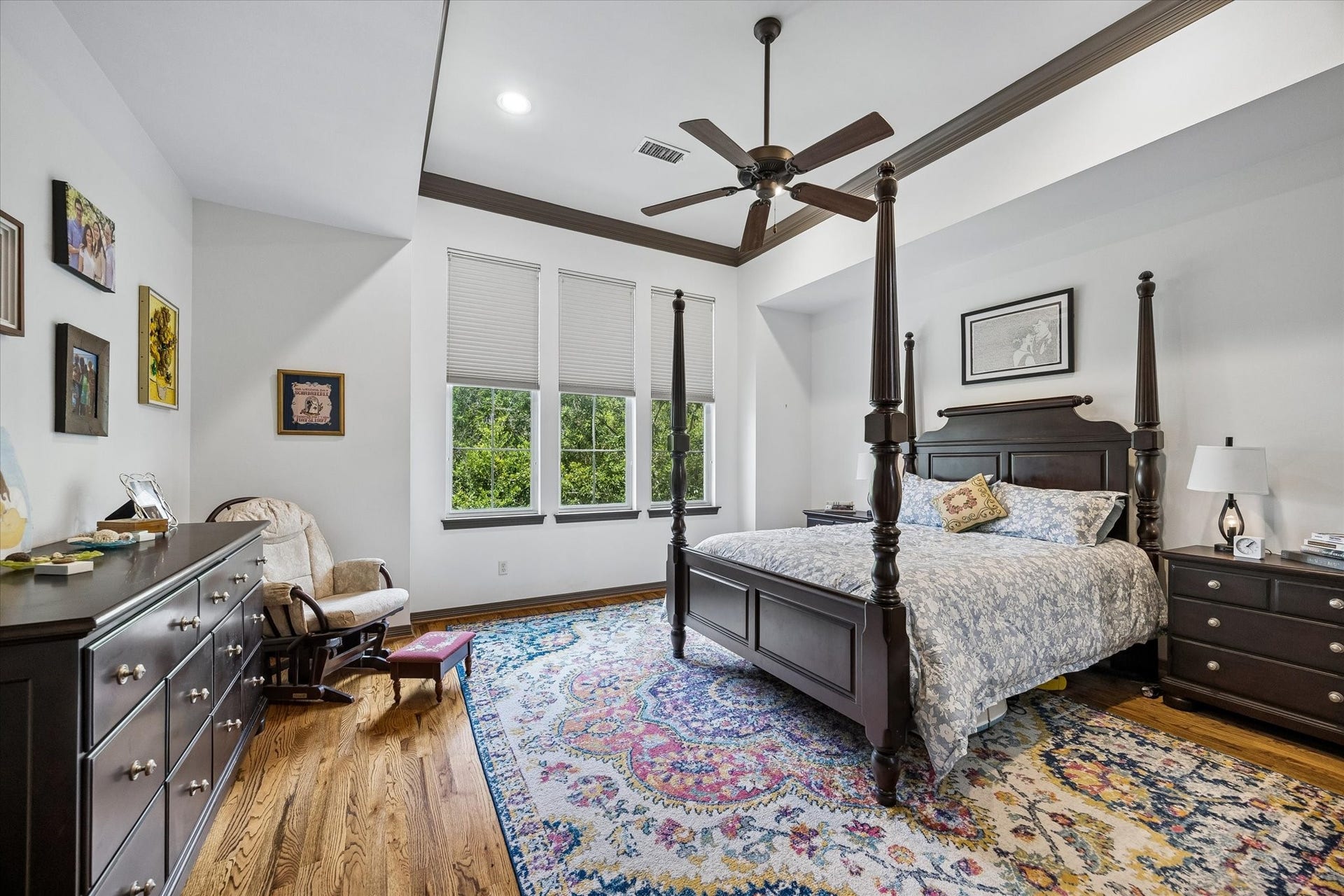 The Master Suite is fit for royalty.  Large in size while at the same time lovely in scale the Master Bedroom features a cove ceiling, hardwood floors and a view of the oak trees.