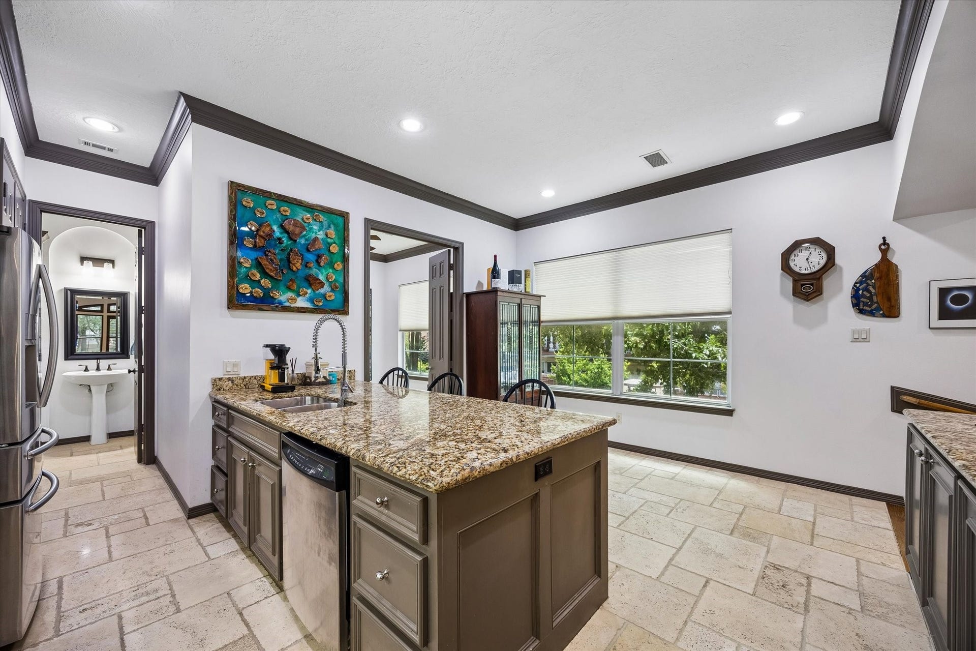 Plentiful counter space surrounds you. At the end of the Kitchen...
