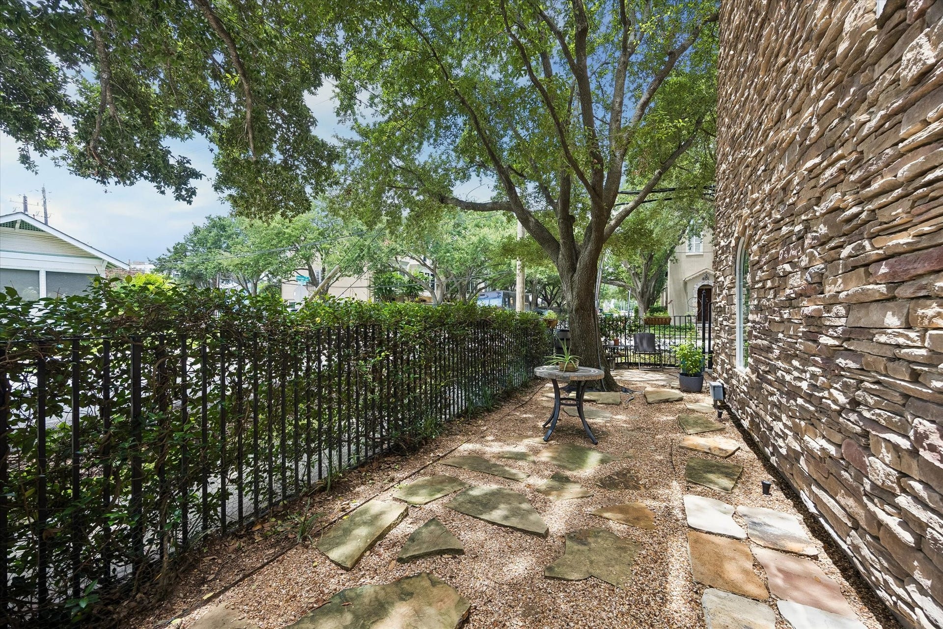 Made in the shade!  This Garden is perfecto for alfresco dining and a run for your pets.