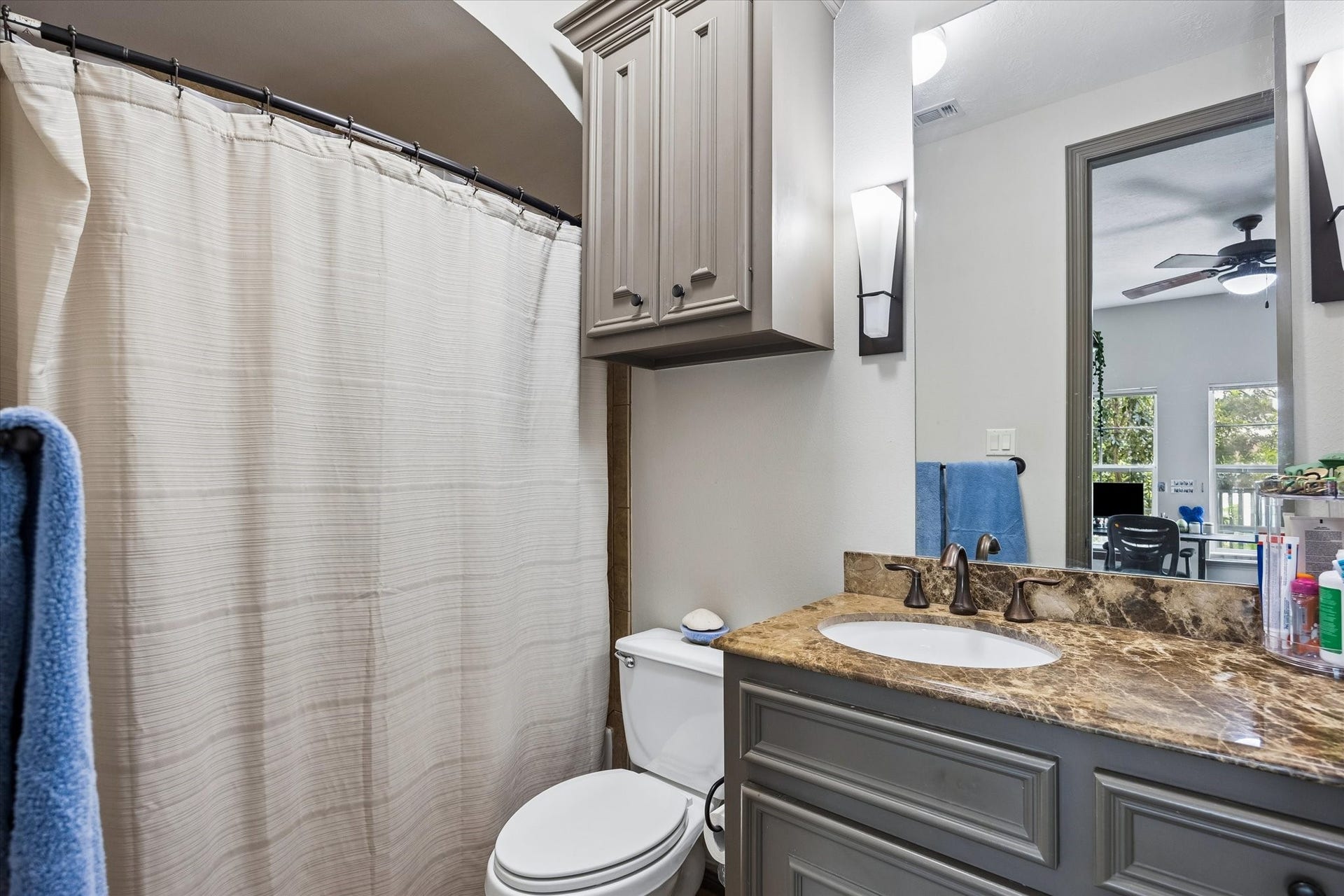 Besides a walk-in Closet, Guest Suite Three had a private Bath with custom cabinetry and a tub/shower combination.
