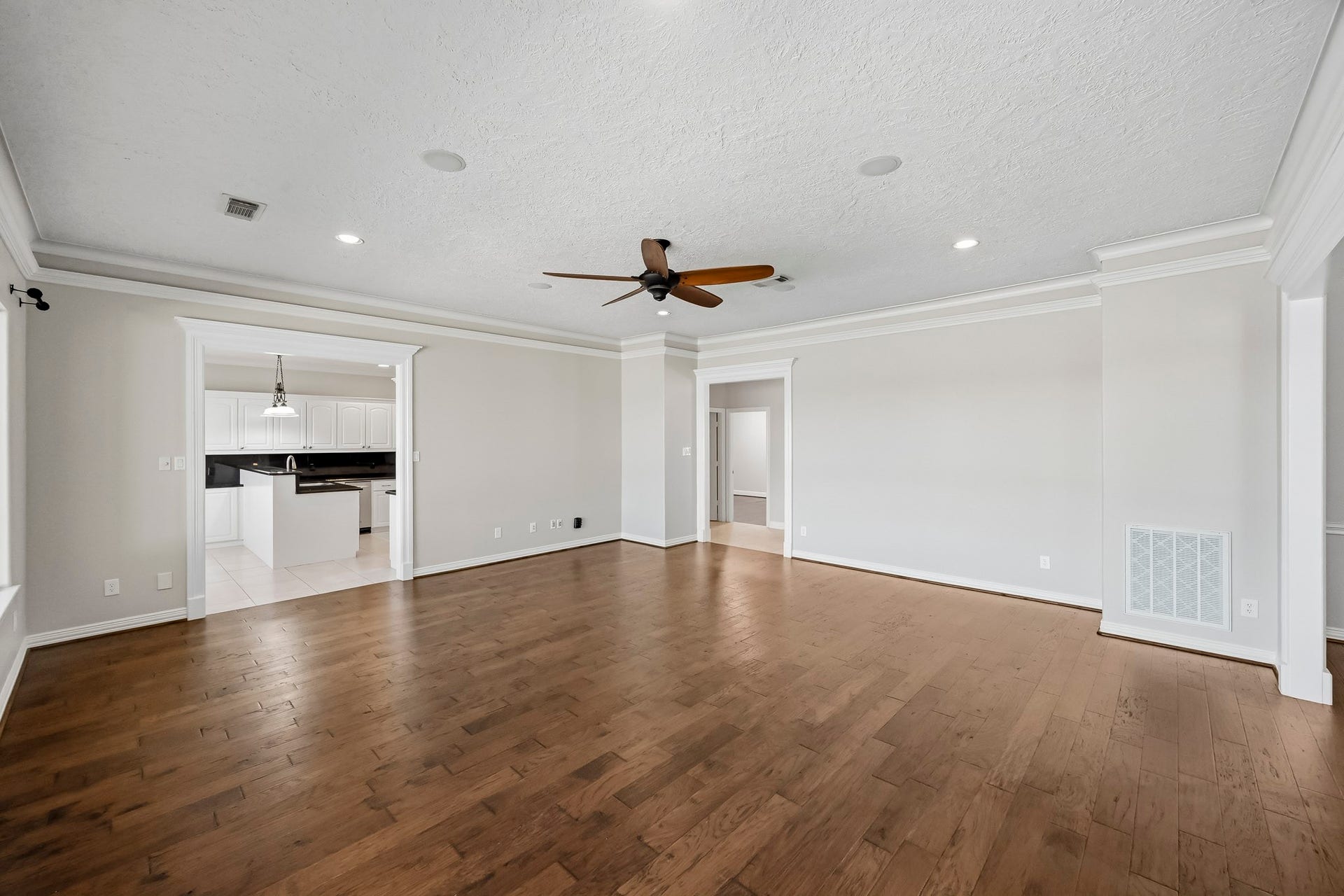 9354 Escondido Drive, Willis, TX 77318 An open connection to the formal dining room and convenient kitchen access create an easy, functional flow for everyday living.