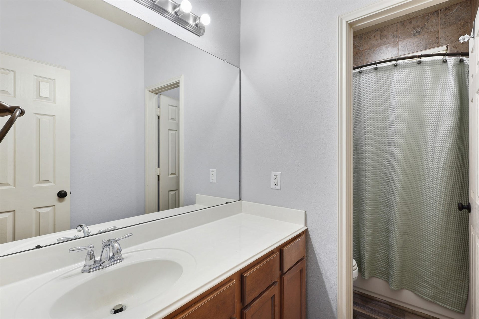 2902 Red Maple Drive, Katy, TX 77494 Secondary Bathroom
The secondary bathroom offers a large vanity with generous counter space, ample cabinet storage, and a full tub/shower combination. Neutral finishes and a functional layout provide comfort and convenience for family members and guests alike.