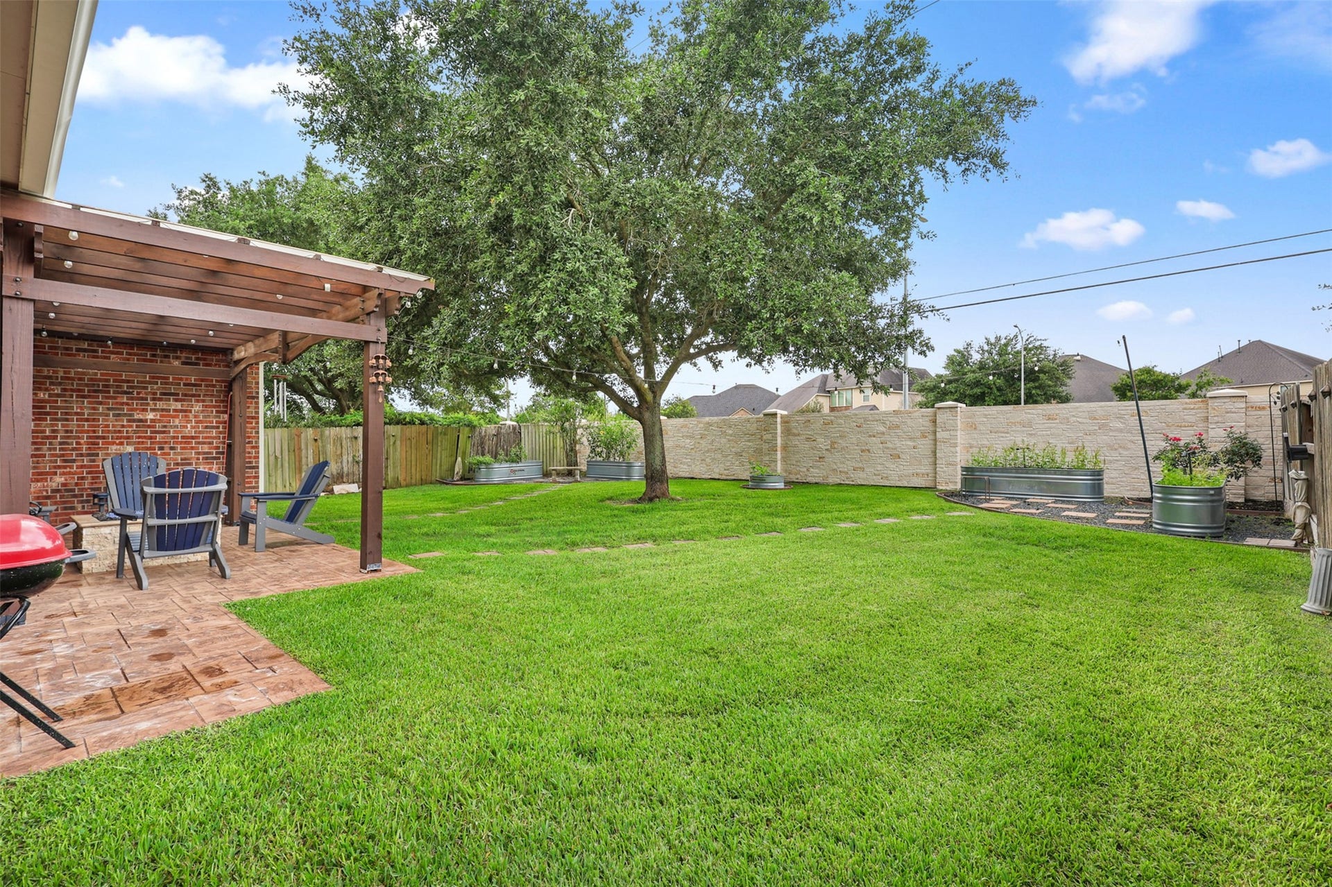 2902 Red Maple Drive, Katy, TX 77494 Another view of the backyard highlights the impressive lot size and thoughtfully designed outdoor living spaces.