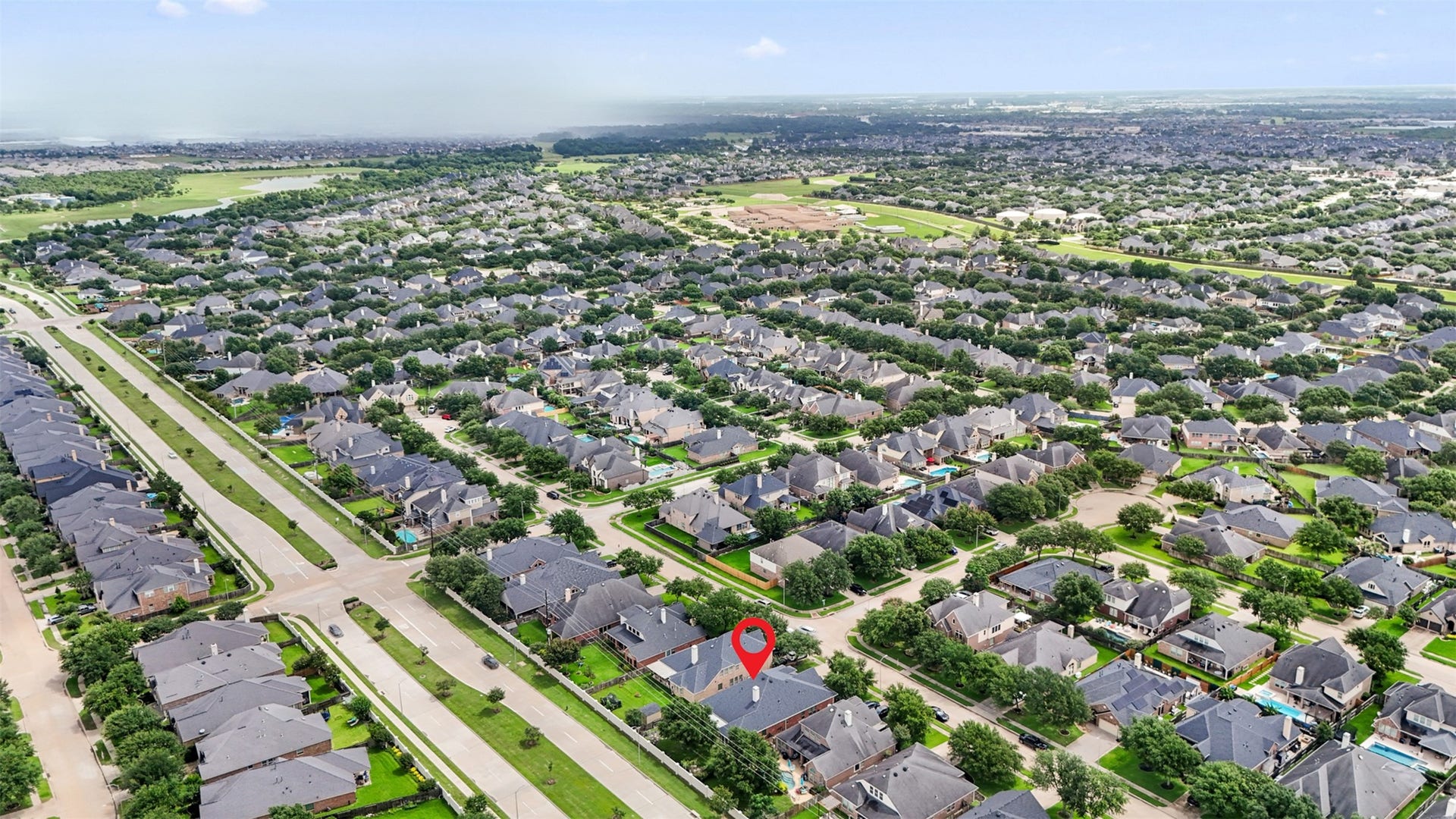 2902 Red Maple Drive, Katy, TX 77494 Aerial views showcase the surrounding community and the home's prime location within the neighborhood. Tree-lined streets, attractive homes, and nearby amenities contribute to the area's strong appeal.