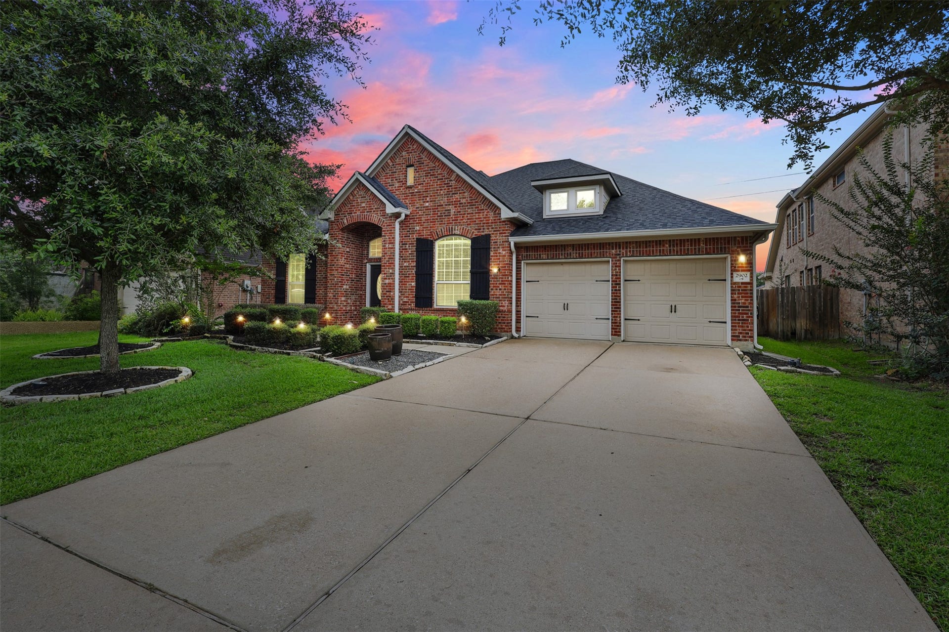 2902 Red Maple Drive, Katy, TX 77494 A closer look at the charming and welcoming entry framed by class brickwork and thoughtfully landscaped beds. Its the perfect place to greet guests or enjoy a quiet moment outdoors.