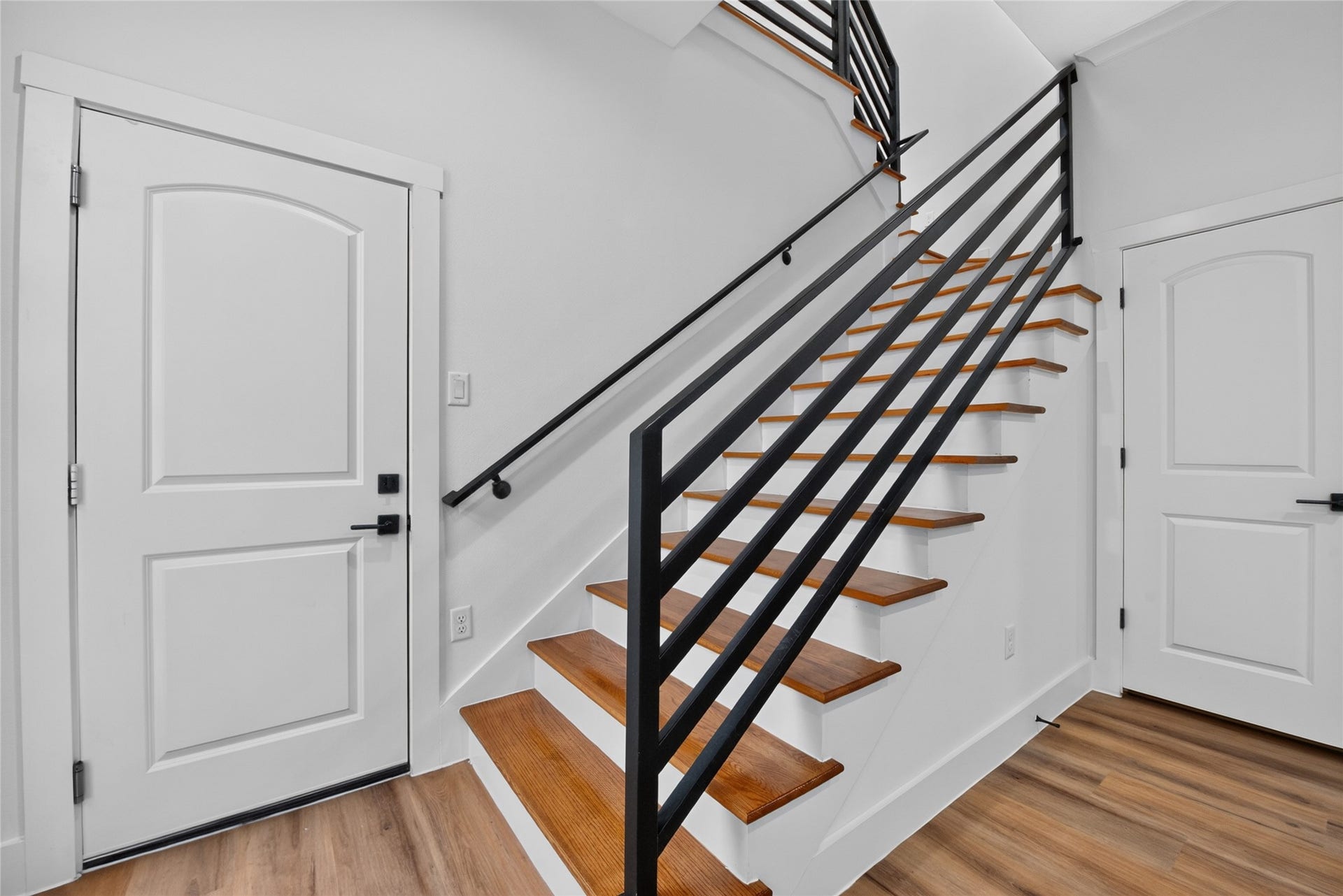 3537 Amos Street, Houston, TX 77021 A convenient garage entry opens directly into the living spaces, while steps to the side lead upstairs to the flex space, bedrooms, and baths.