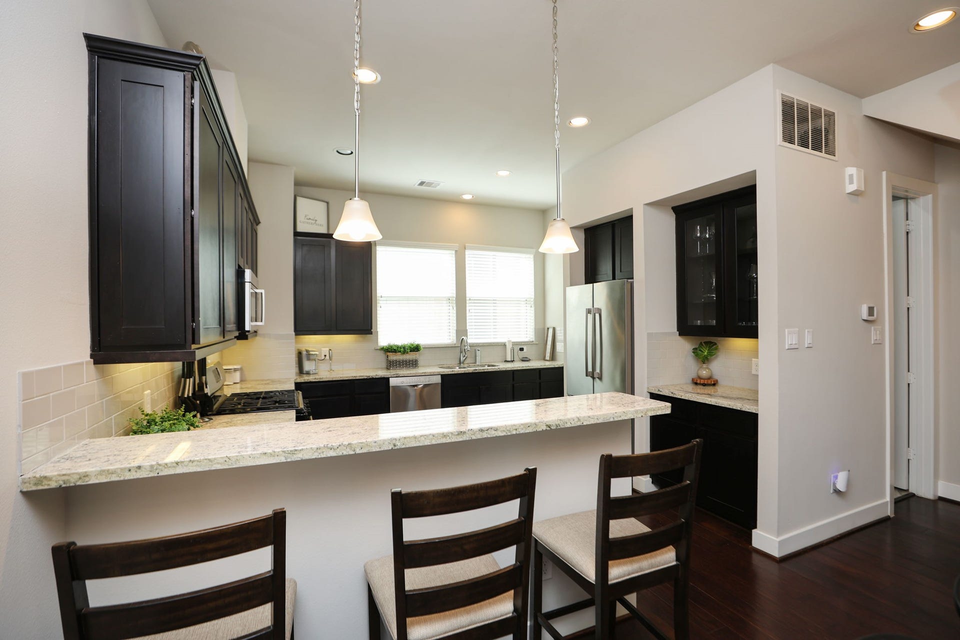 4515 Cornish Street, #A, Houston, TX 77007 Double sided SS refrigerator, dry bar with glass cabinets, and a full pantry to the back right.