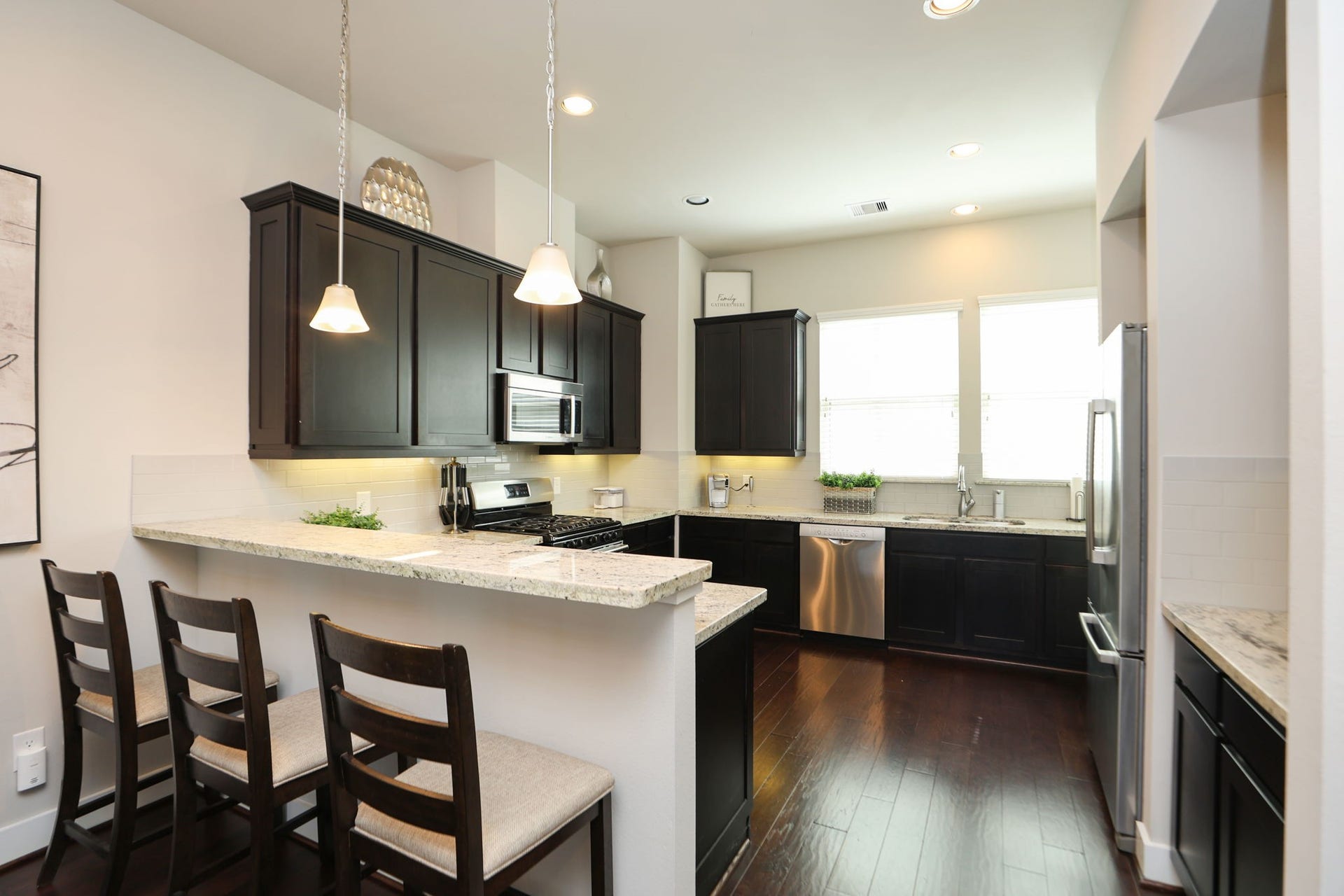 4515 Cornish Street, #A, Houston, TX 77007 Large kitchen features light granite countertops, a gas range, wine fridge, dry bar, and large windows over your sink - with plenty of room to prepare meals!