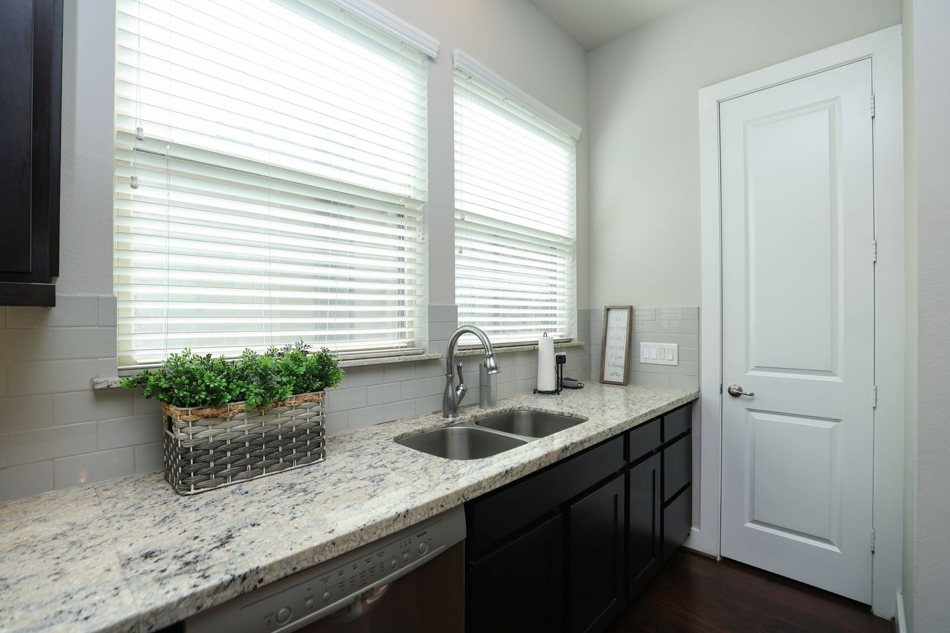 4515 Cornish Street, #A, Houston, TX 77007 View of the sink with 2 large windows, window coverings, and door to your full pantry. Home appears basically new with modern touches and paint.