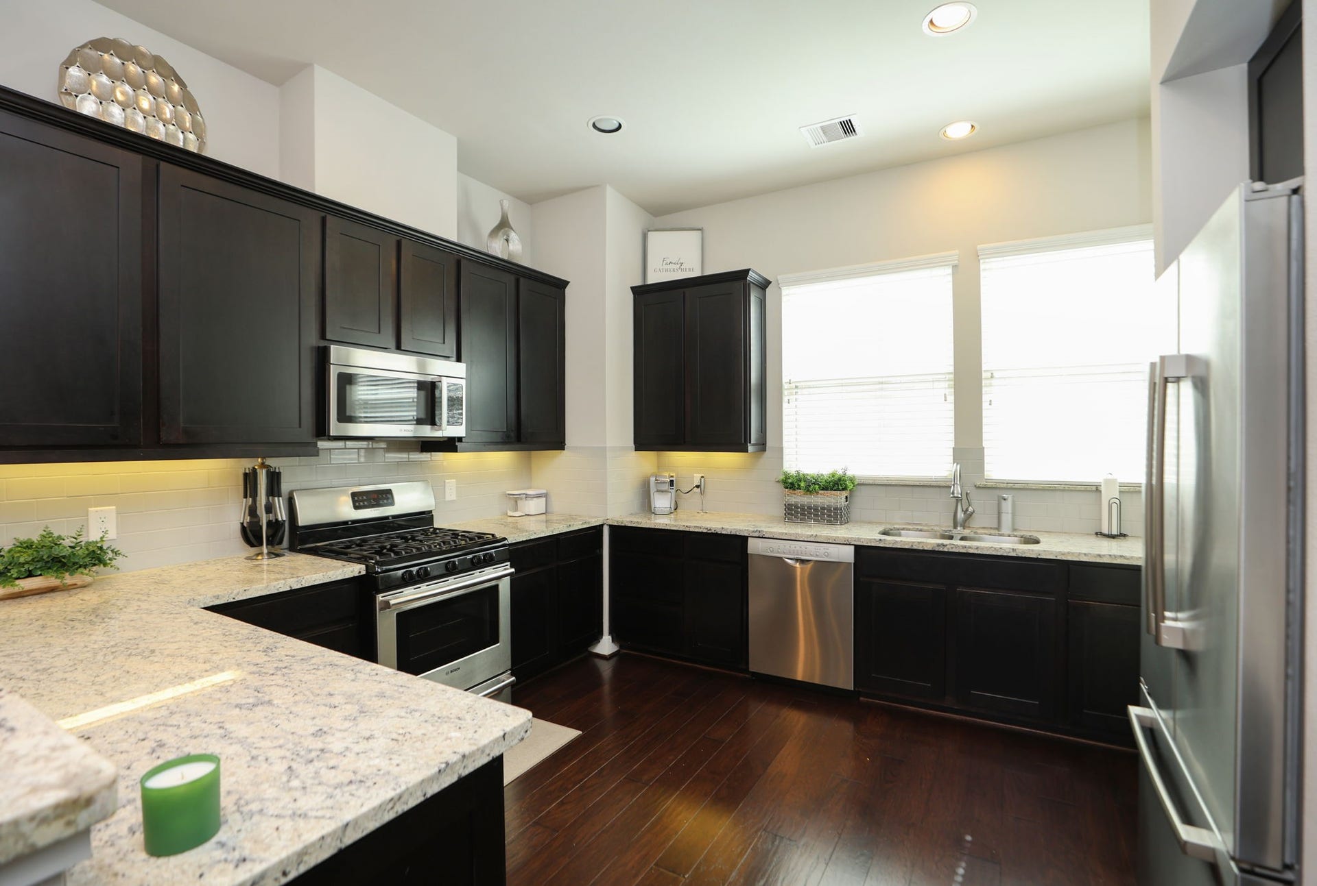 4515 Cornish Street, #A, Houston, TX 77007 Classy dark cabinets with light granite countertops and dark wood floors give a perfectly open feel with the windows and high ceiling.