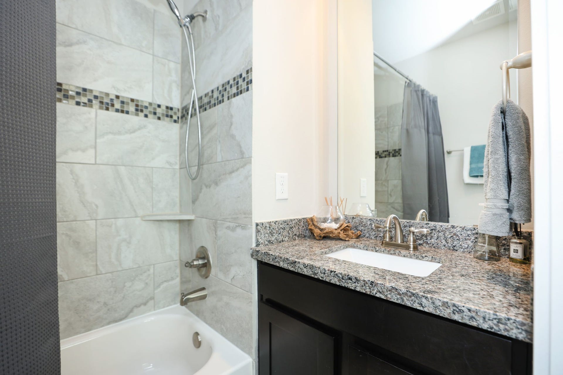 4515 Cornish Street, #A, Houston, TX 77007 3rd full bath with tub/shower combo, modern tile, granite countertops, and dark wood cabinetry. Whole home feels modern and very clean!
