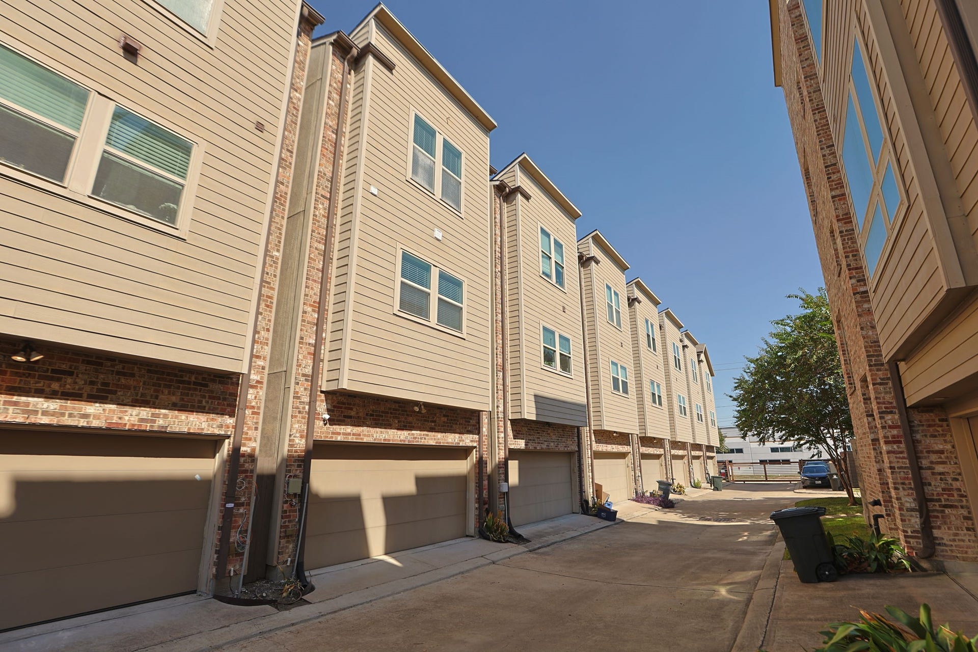 4515 Cornish Street, #A, Houston, TX 77007 Home is to the left, gated entrance can be seen at the end of the shared driveway, and park is to the right with the trees. Take the dog out and make friends easily!