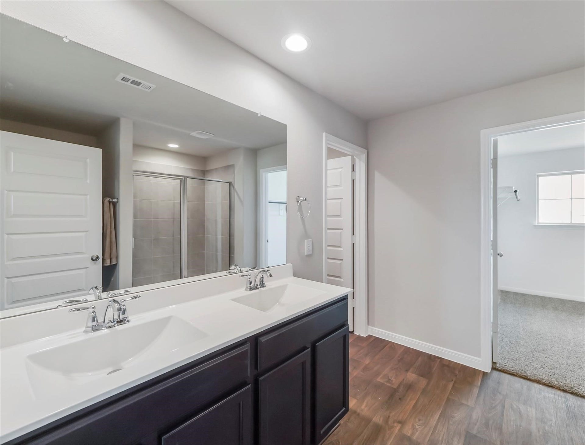 13009 Leisure Cove Drive, Texas City, TX 77568 Private primary bath with an oversized walk-in shower and plenty of storage space.