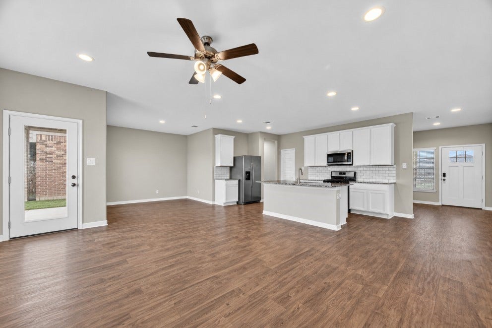 13009 Leisure Cove Drive, Texas City, TX 77568 Open-concept living, dining, and kitchen area made for gathering.